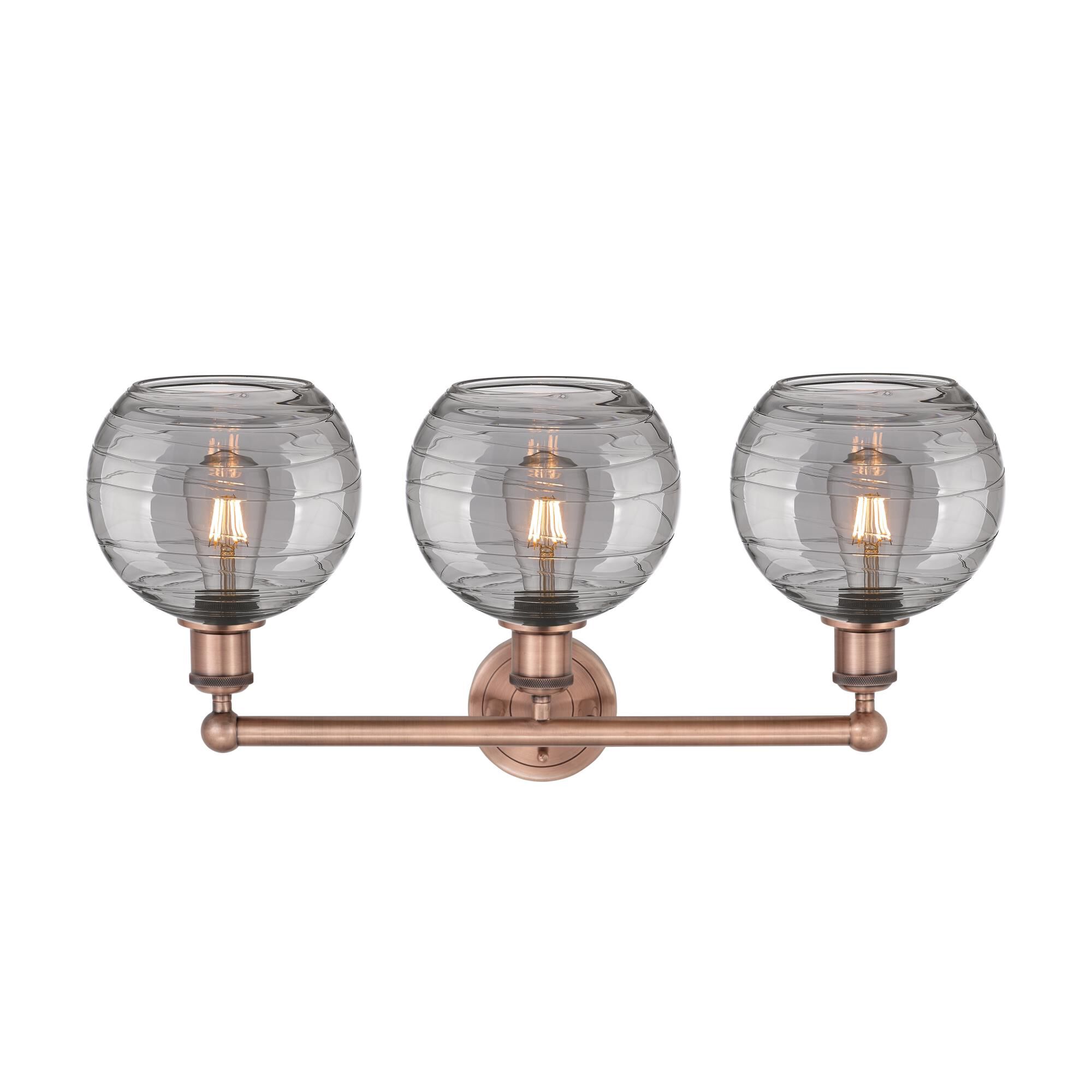 Shown in Antique Copper finish and Light Smoke Deco Swirl glass