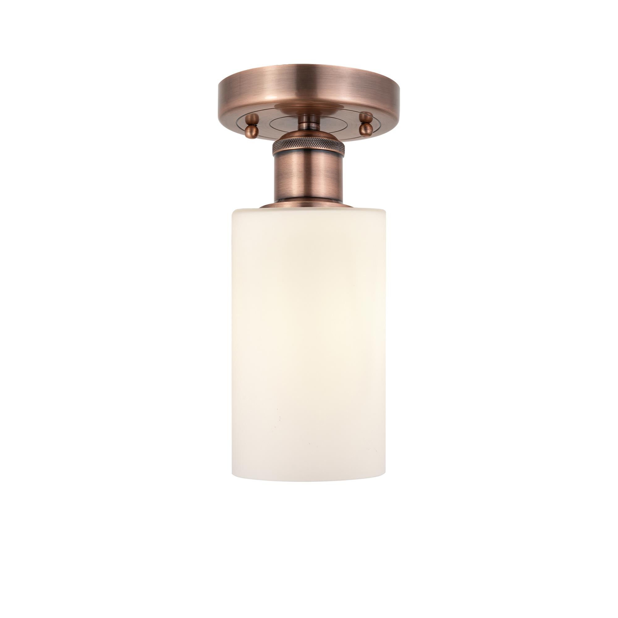 Shown in Antique Copper finish and Matte White glass