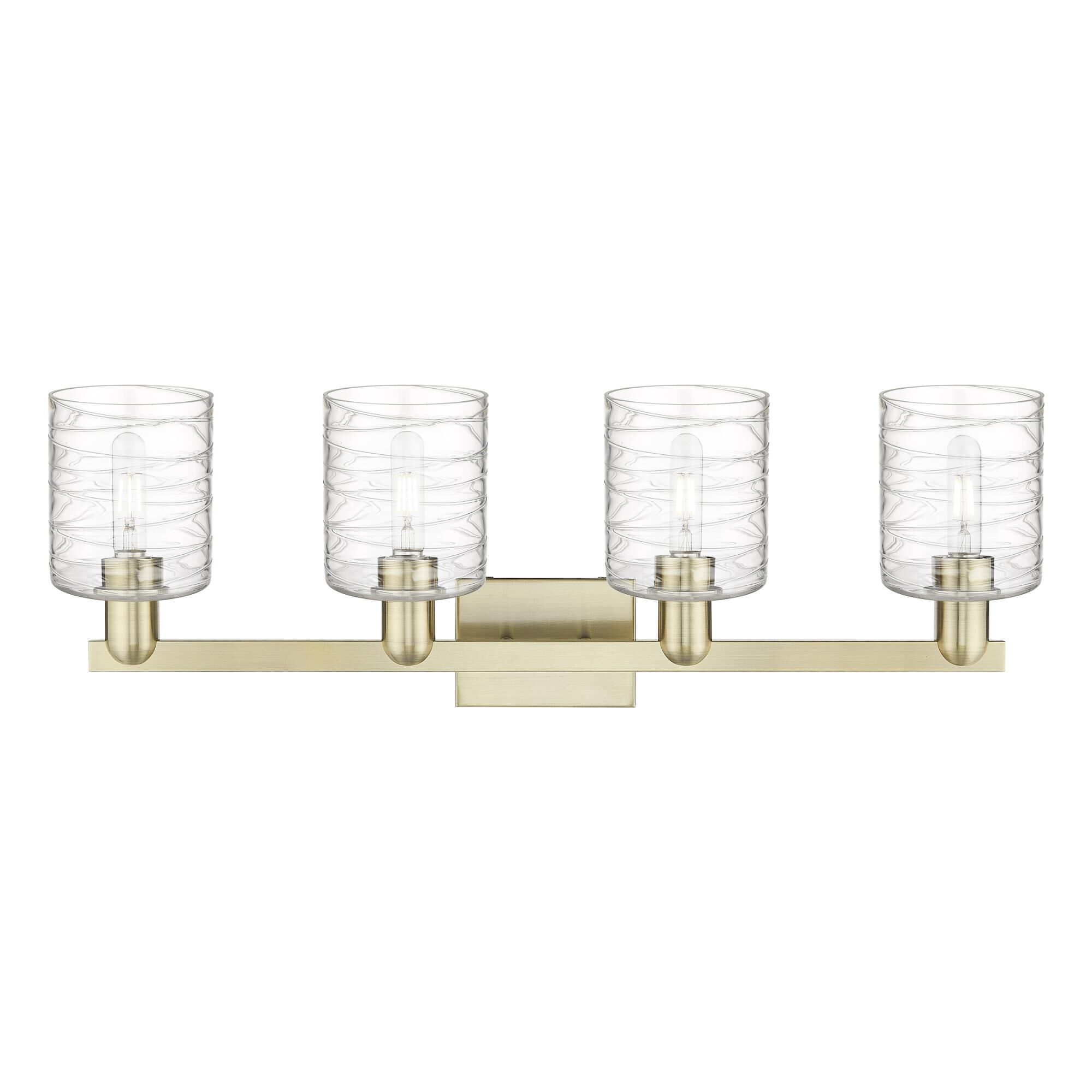 Shown in Antique Brass finish and Deco Swirl glass