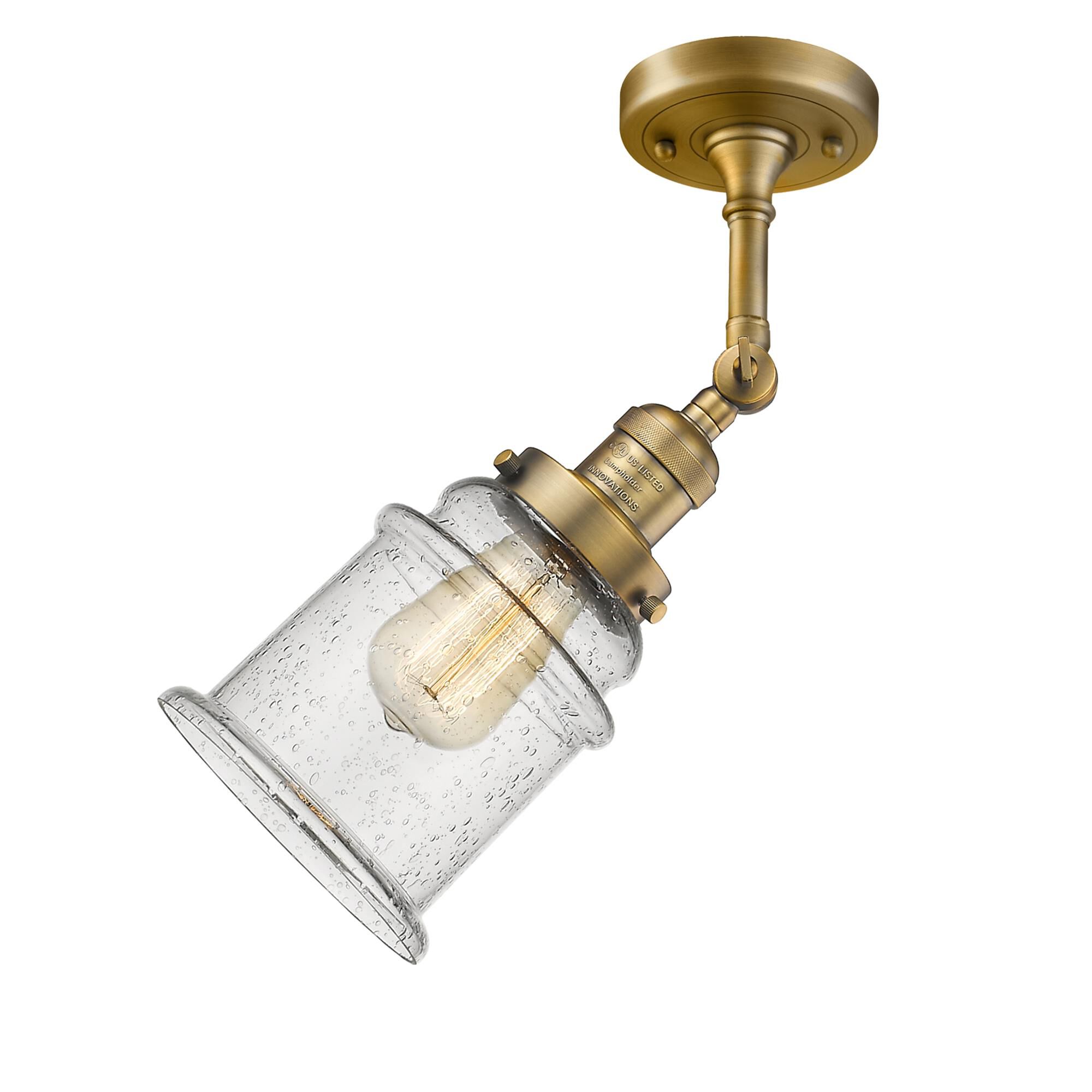 Shown in Brushed Brass finish and Seedy glass and None accent