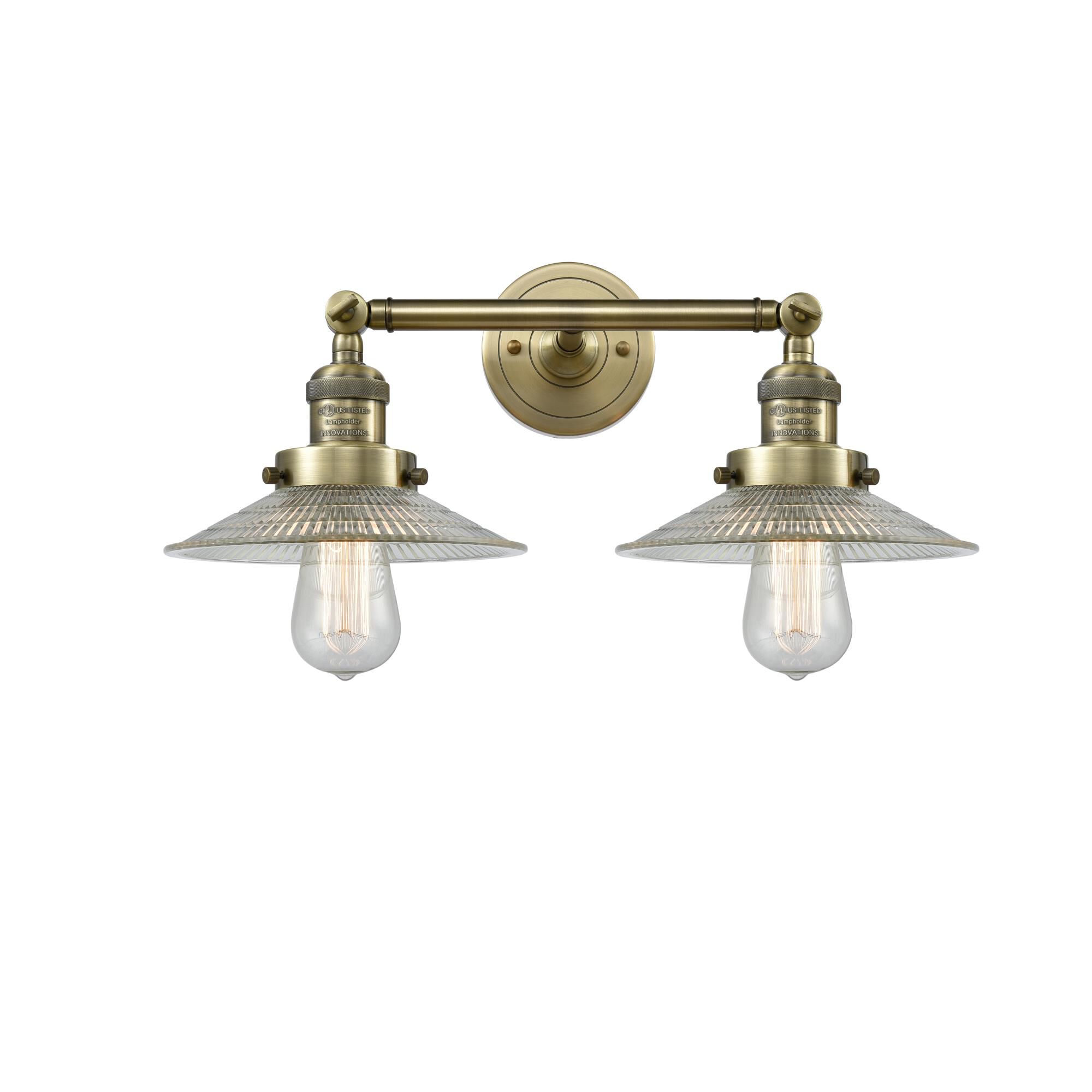 Shown in Antique Brass finish and Clear Halophane glass