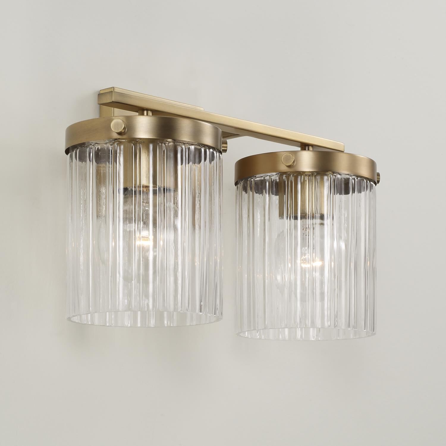 Shown in Aged Brass finish and Beveled Fluted glass