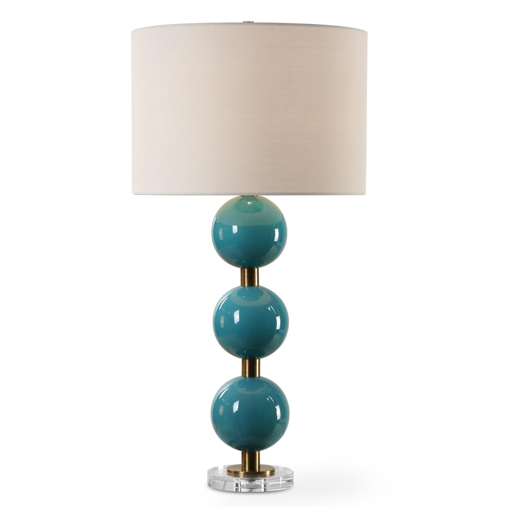 Shown in Elevate Your Space With Our Captivating Table Lamp Featuring Stacked Ceramic Spheres Adorned In A Cr finish and Round Drum Hardback shade