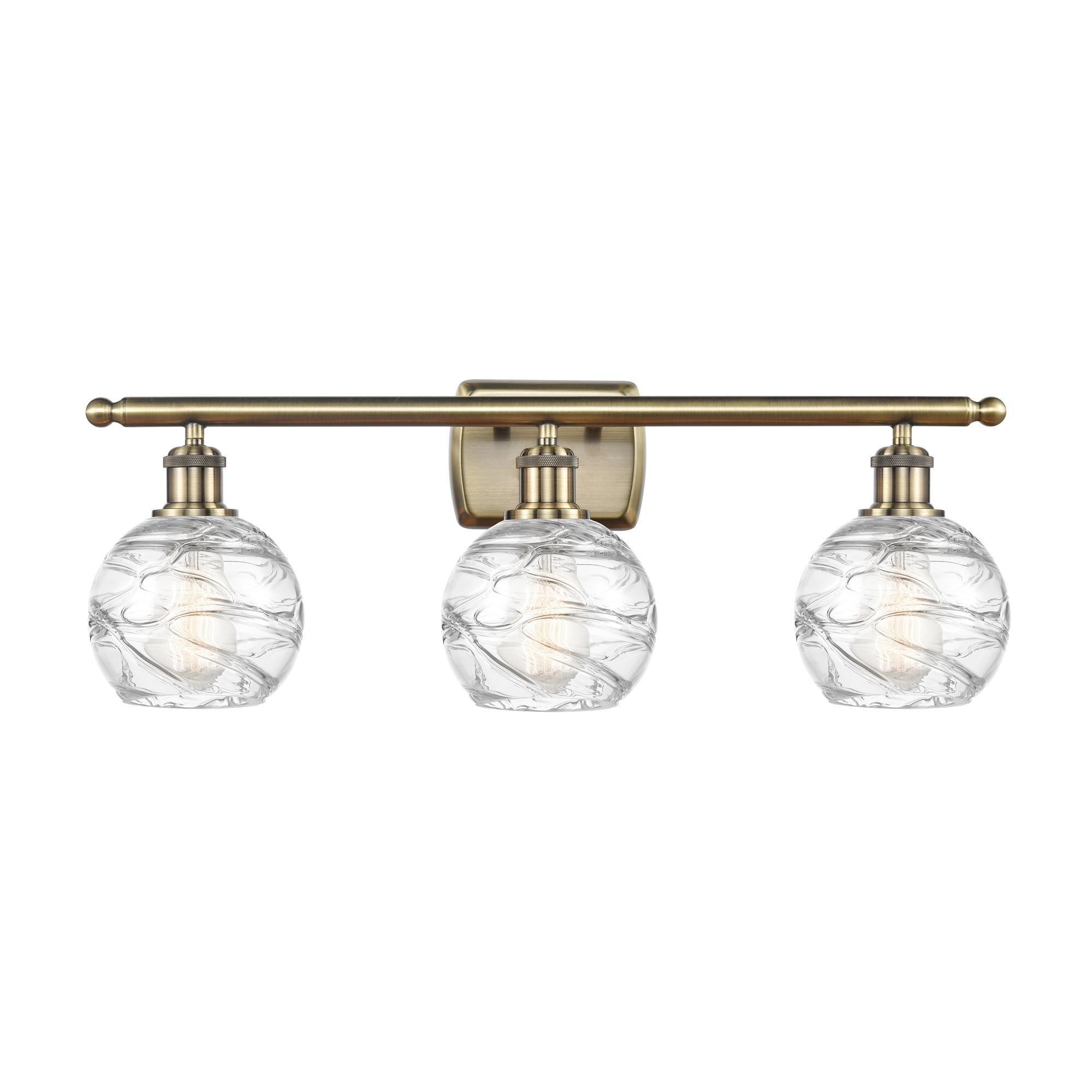 Shown in Antique Brass finish and Sphere glass and Glass shade