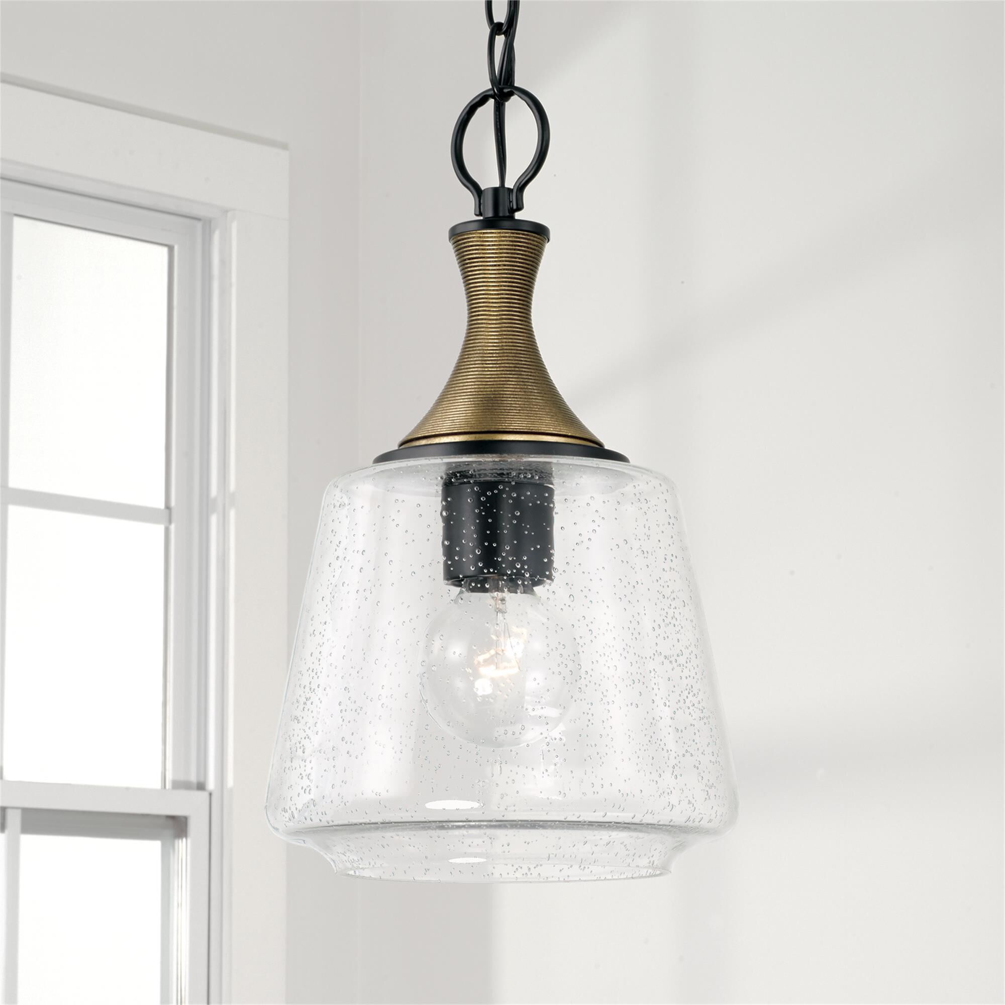 Shown in Matte Black With Brass finish and Clear Seeded glass