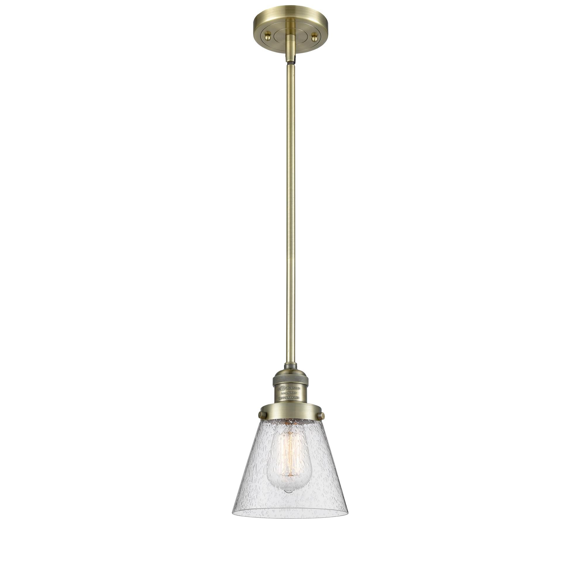 Shown in Antique Brass finish and Seedy glass