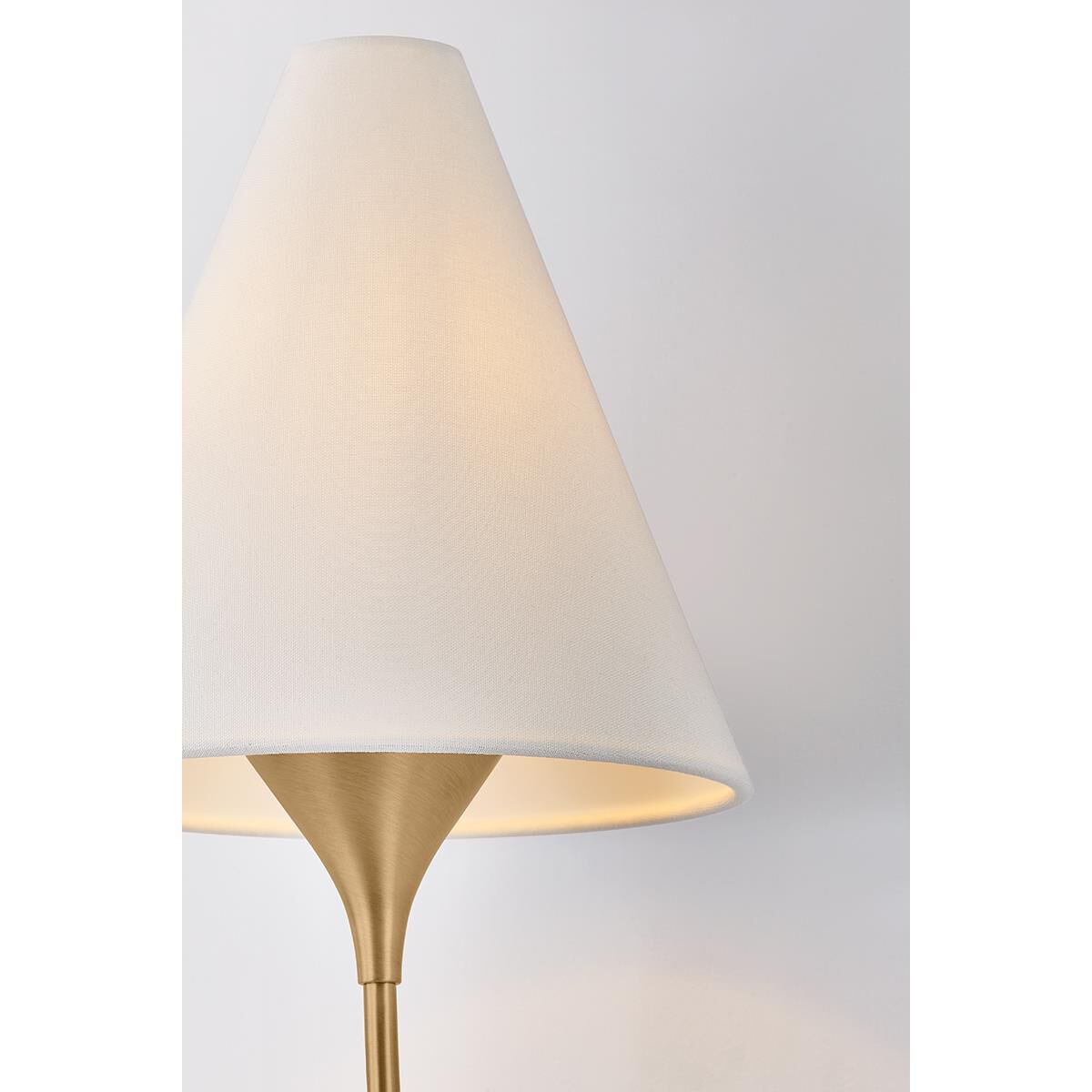 Shown in Patina Brass finish and Off White Linen shade