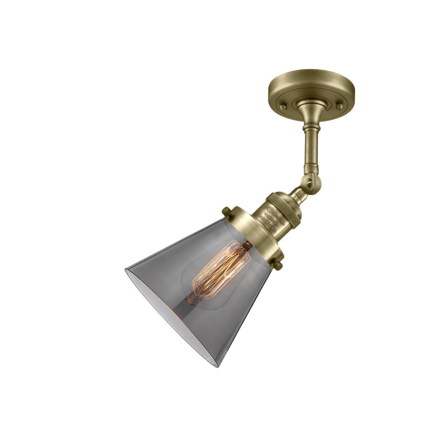 Shown in Antique Brass finish and Smoked glass and None accent