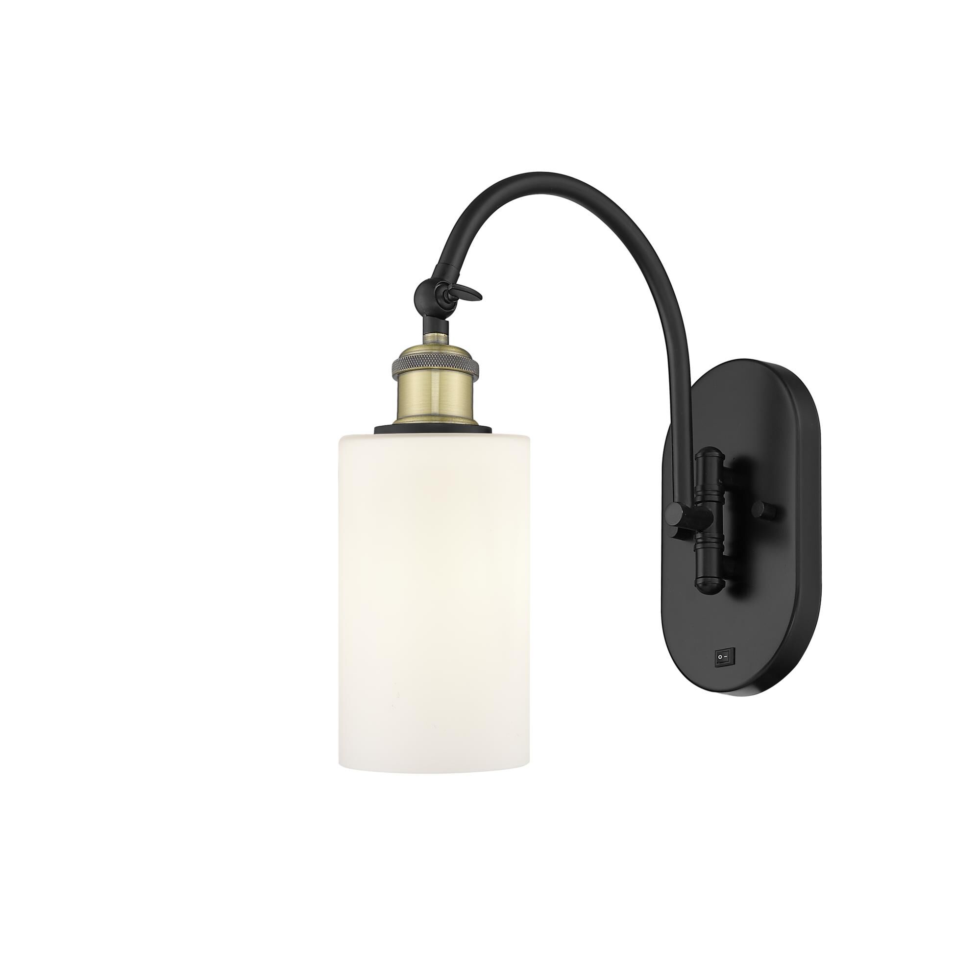 Shown in Black Antique Brass finish and Matte White Clymer glass