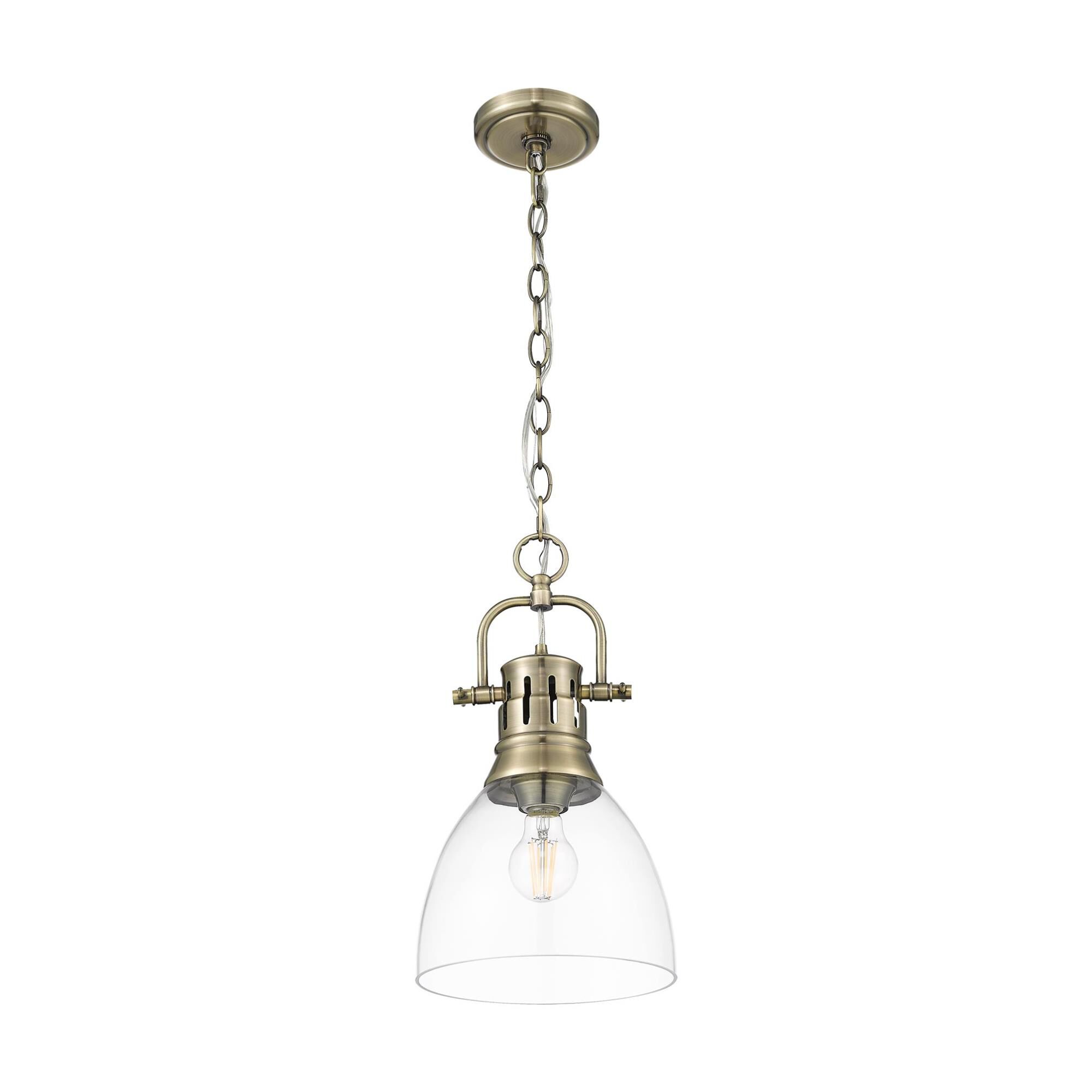 Shown in Aged Brass finish and Clear Glass shade