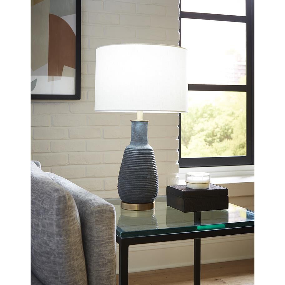 Shown in Brass finish and Seasalt glass and Seasalt Linen Drum shade