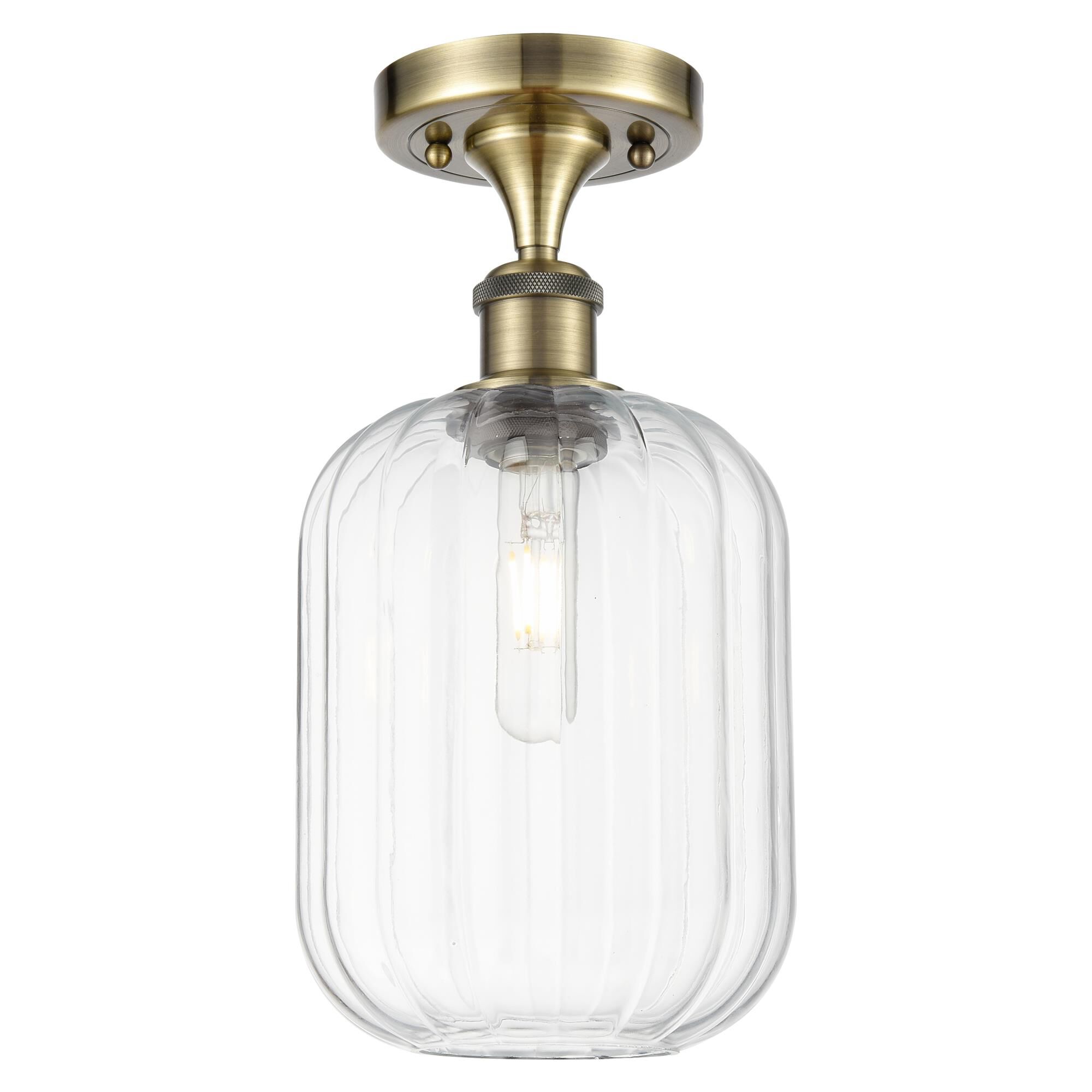 Shown in Antique Brass finish and Clear glass