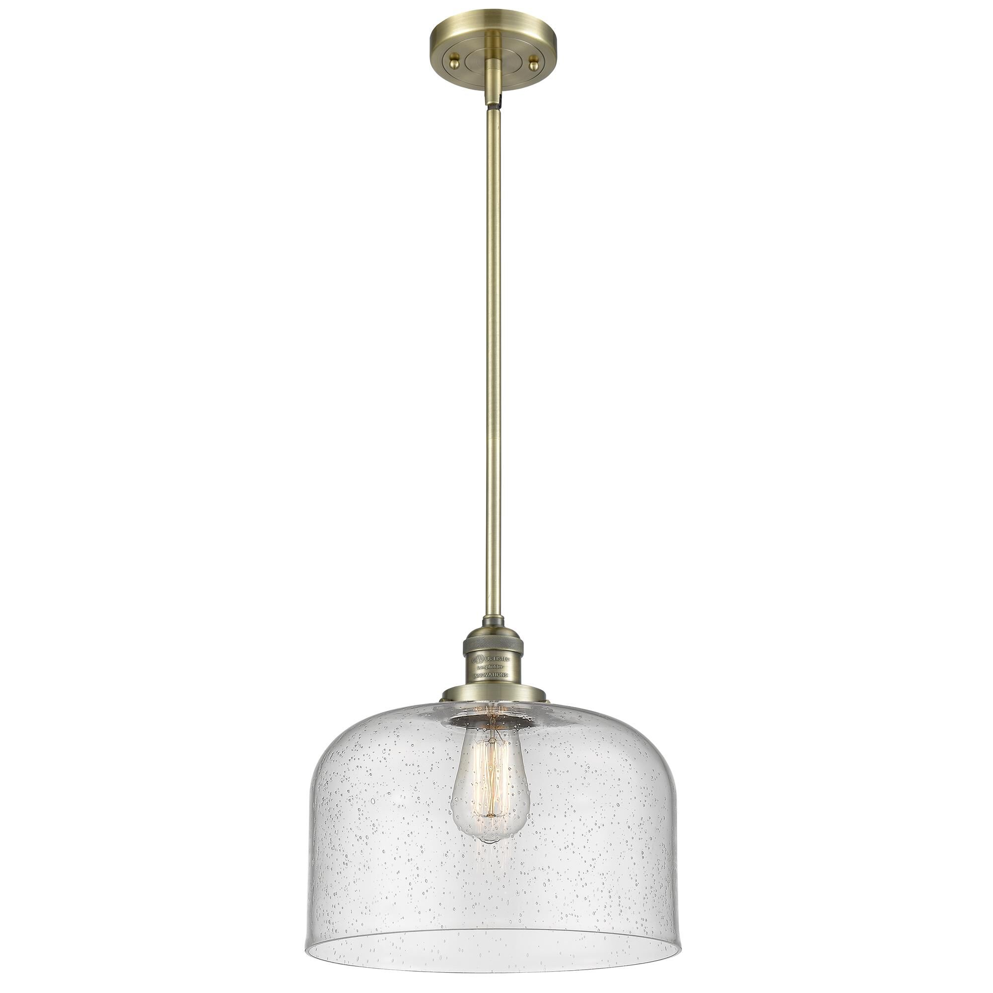 Shown in Antique Brass finish and Seedy glass