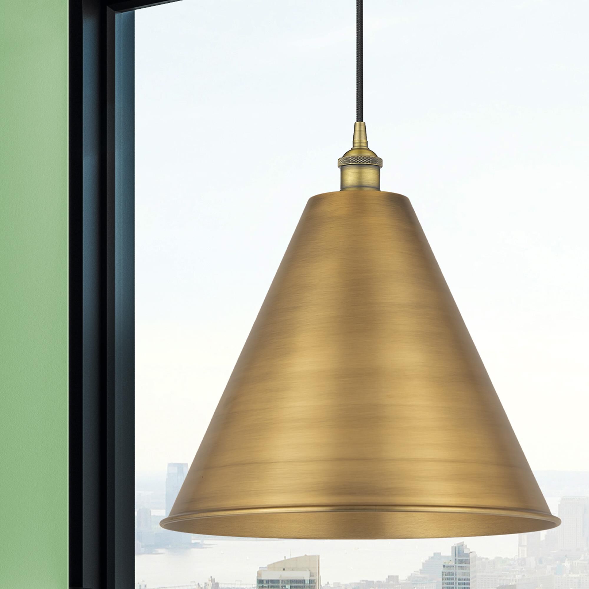 Shown in Brushed Brass finish and Matte Black Edison Cone shade