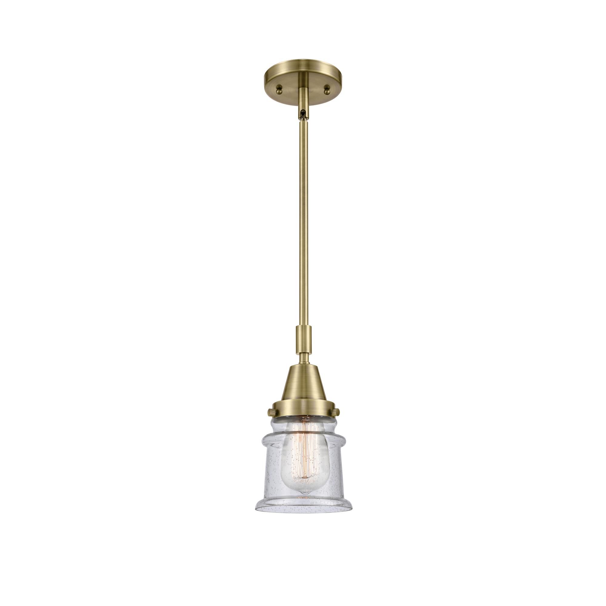Shown in Antique Brass finish and Seedy Canton glass