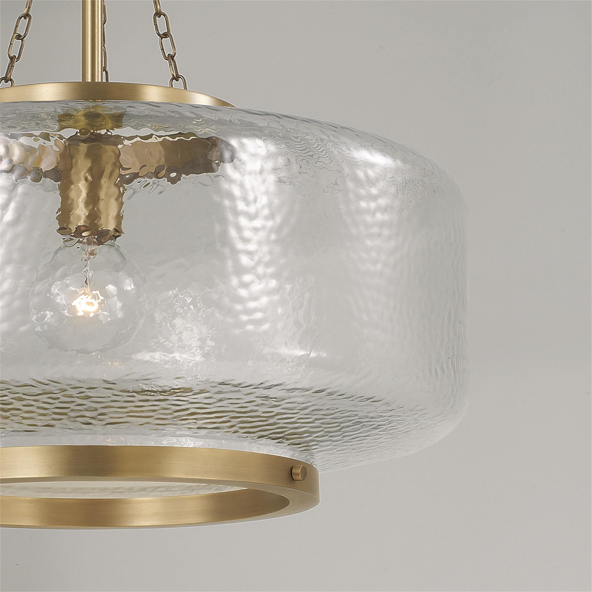 Shown in Aged Brass finish and Organic Hammered glass