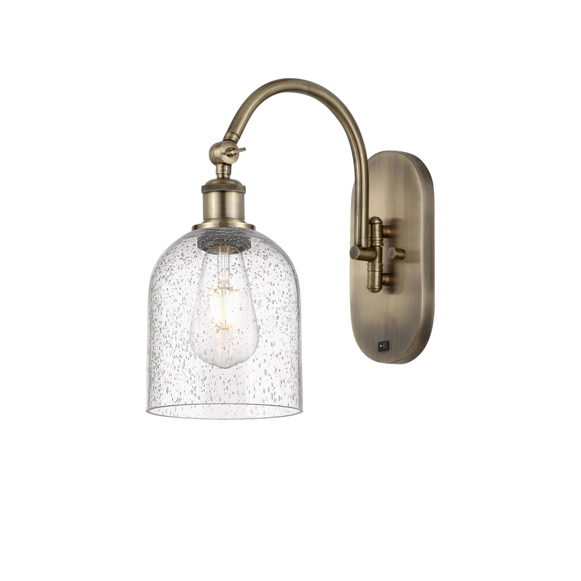 Shown in Antique Brass finish and Seedy glass