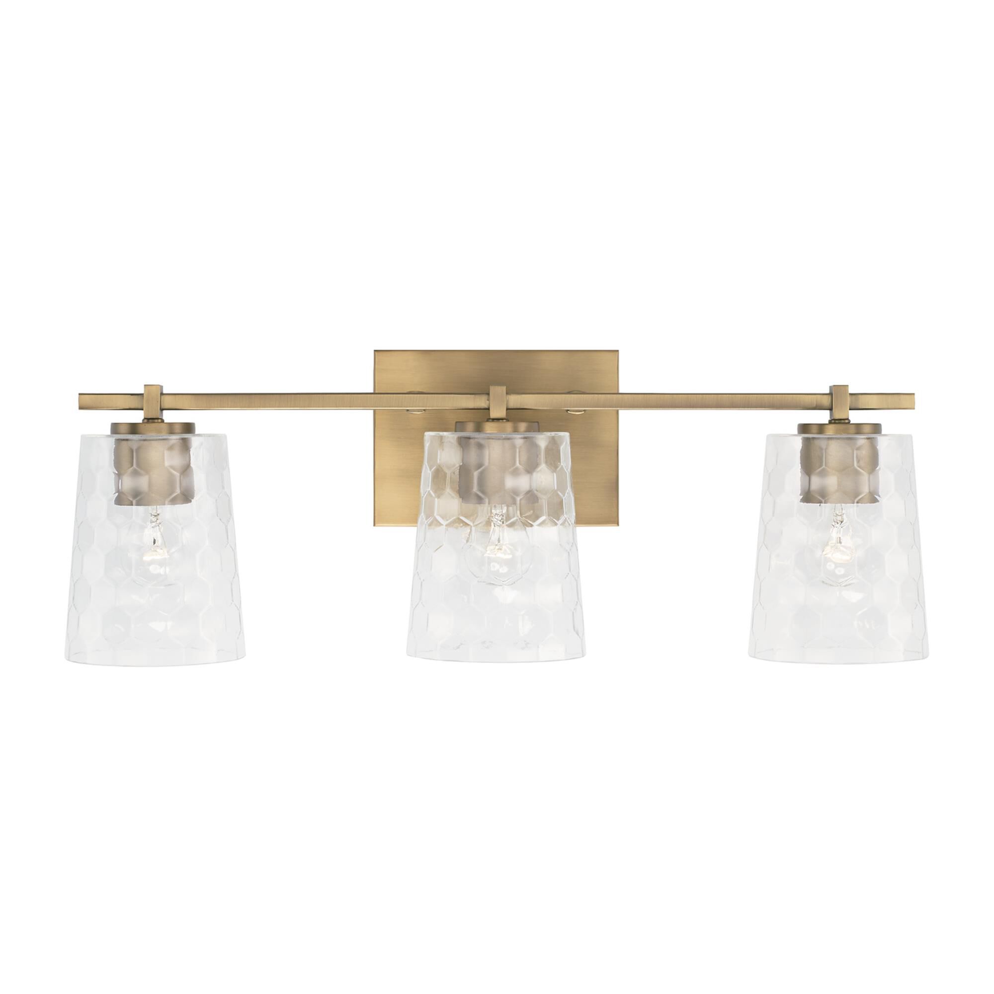 Shown in Aged Brass finish and Clear Honeycomb glass