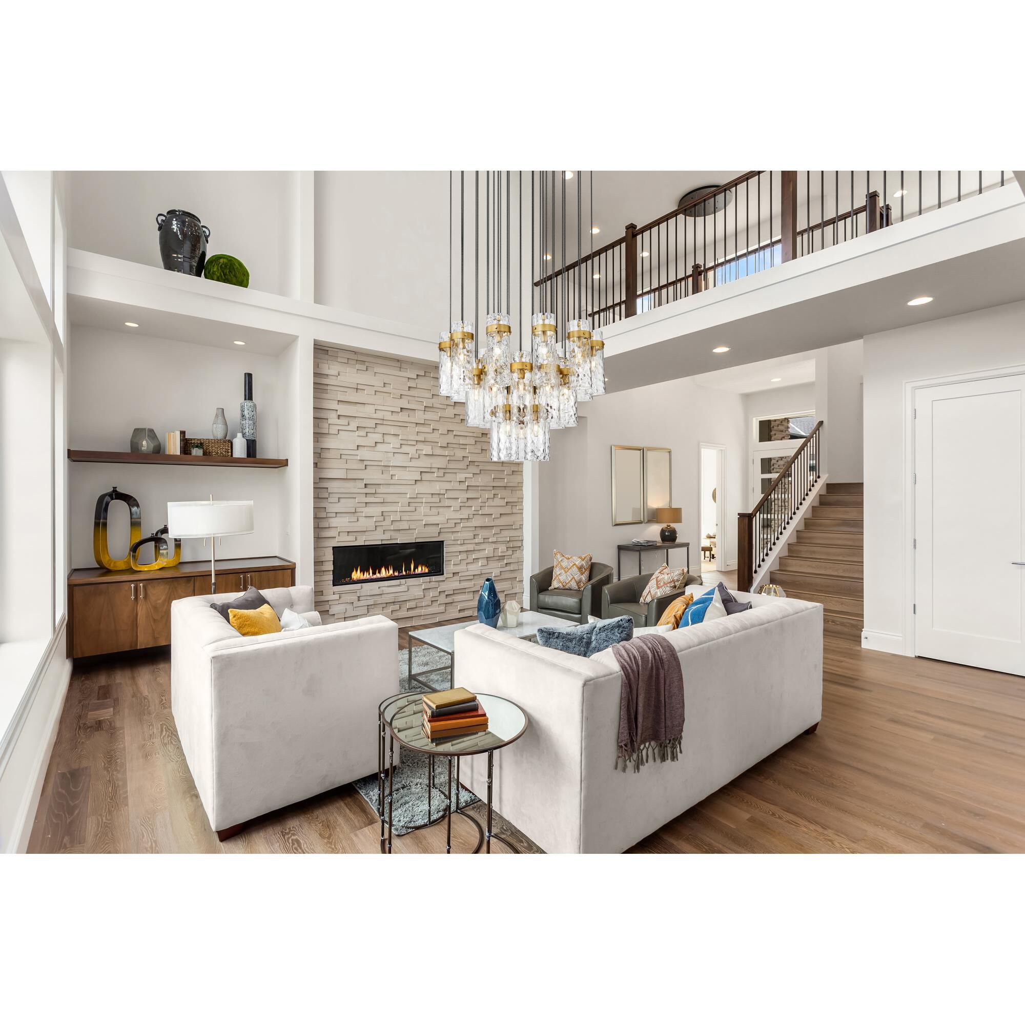 Shown in Rubbed Brass finish and Clear Water glass and Clear Water shade