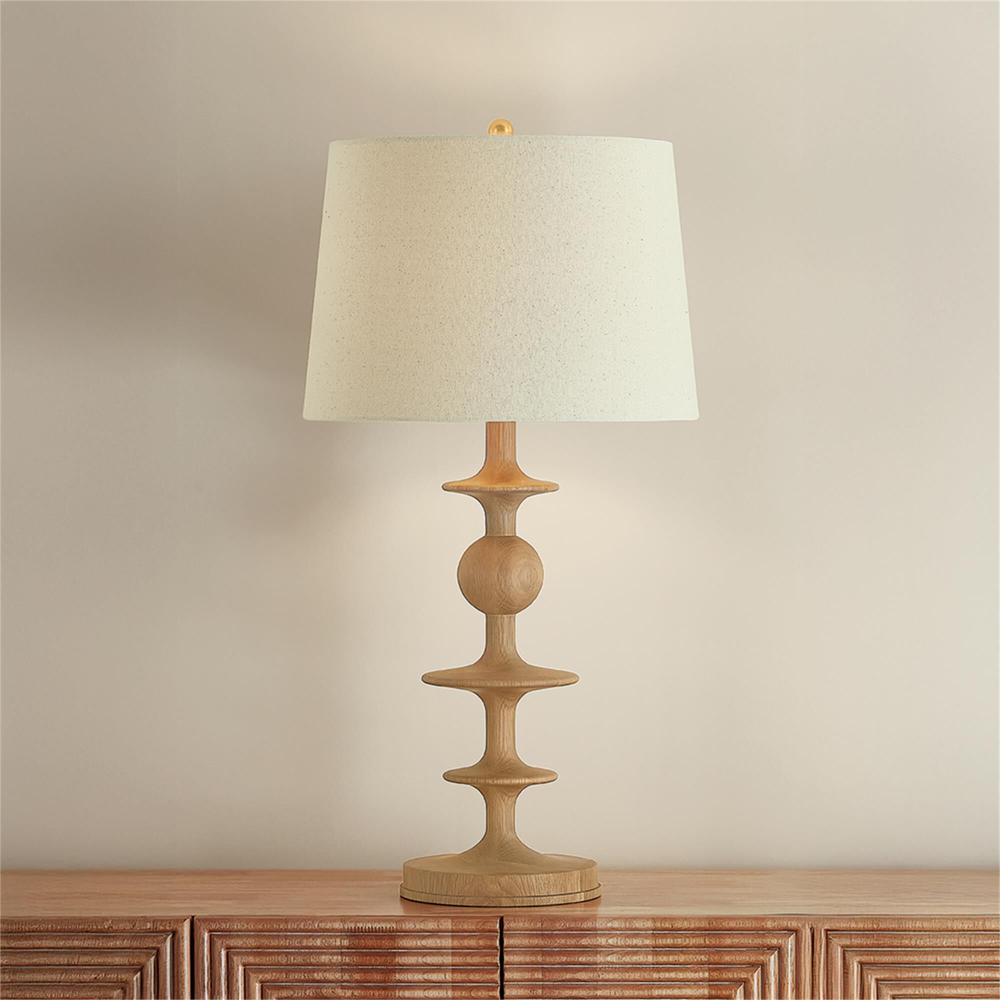 Shown in Aged Brass finish and Wheat Linen shade