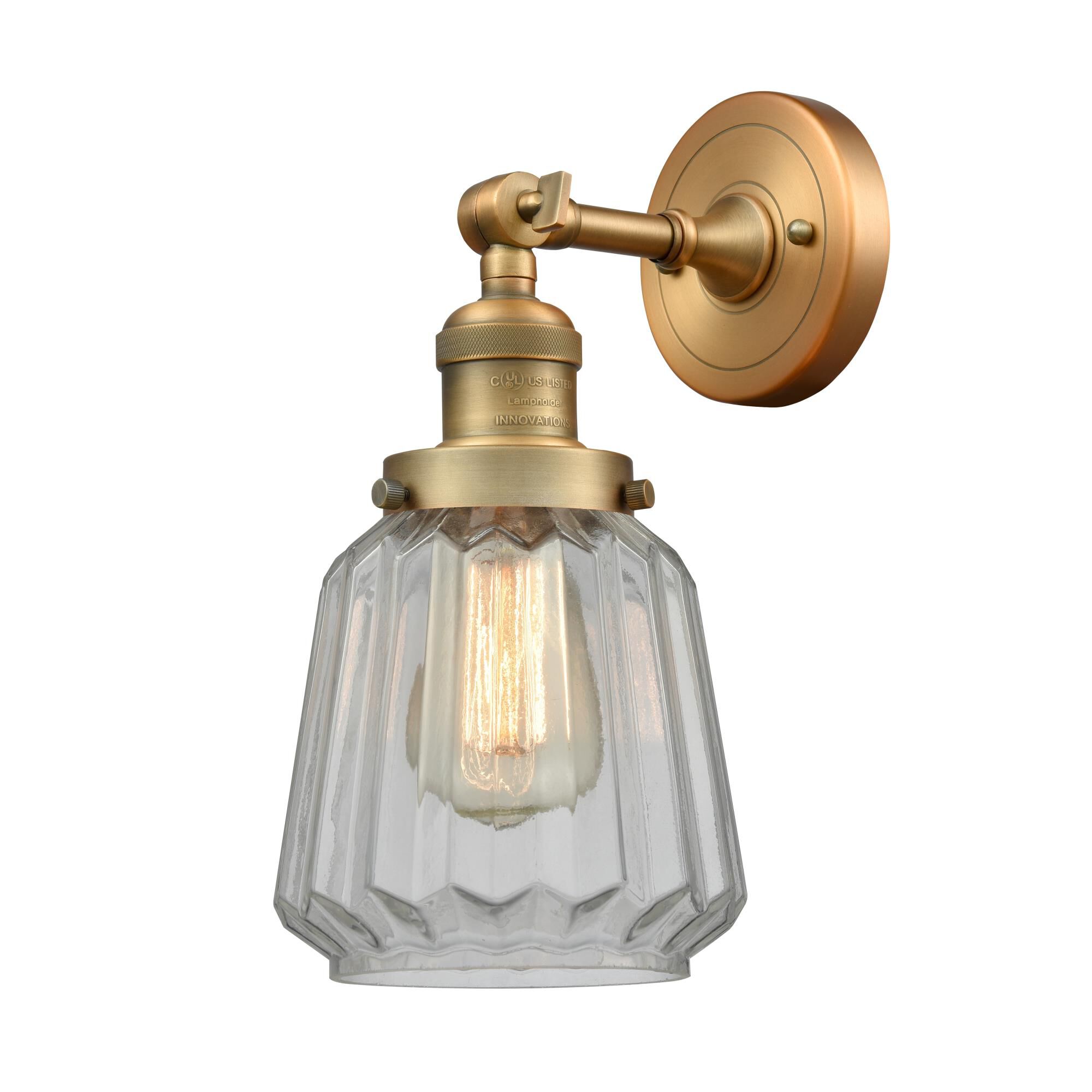 Shown in Brushed Brass finish and Clear Fluted glass
