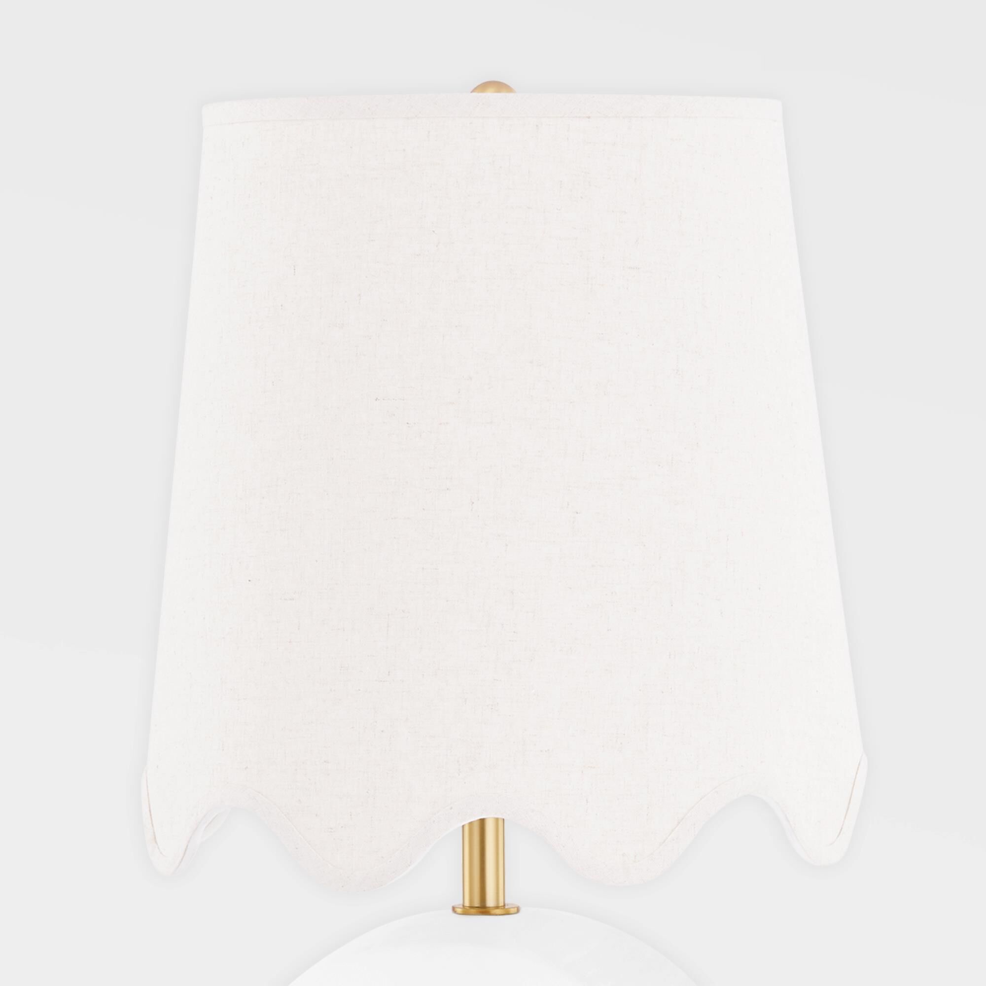 Shown in Aged Brass and Ceramic Raw Matte White finish and Natural Linen shade