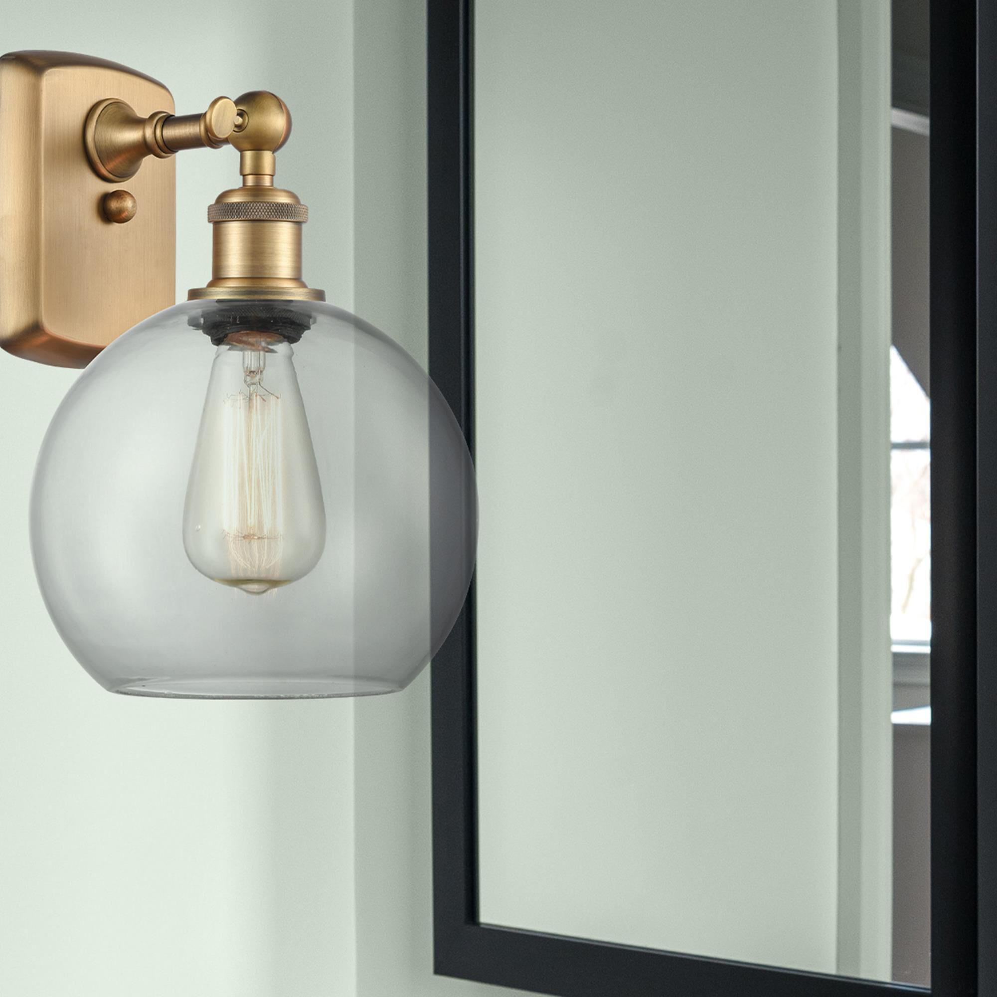 Shown in Brushed Brass finish and Clear glass