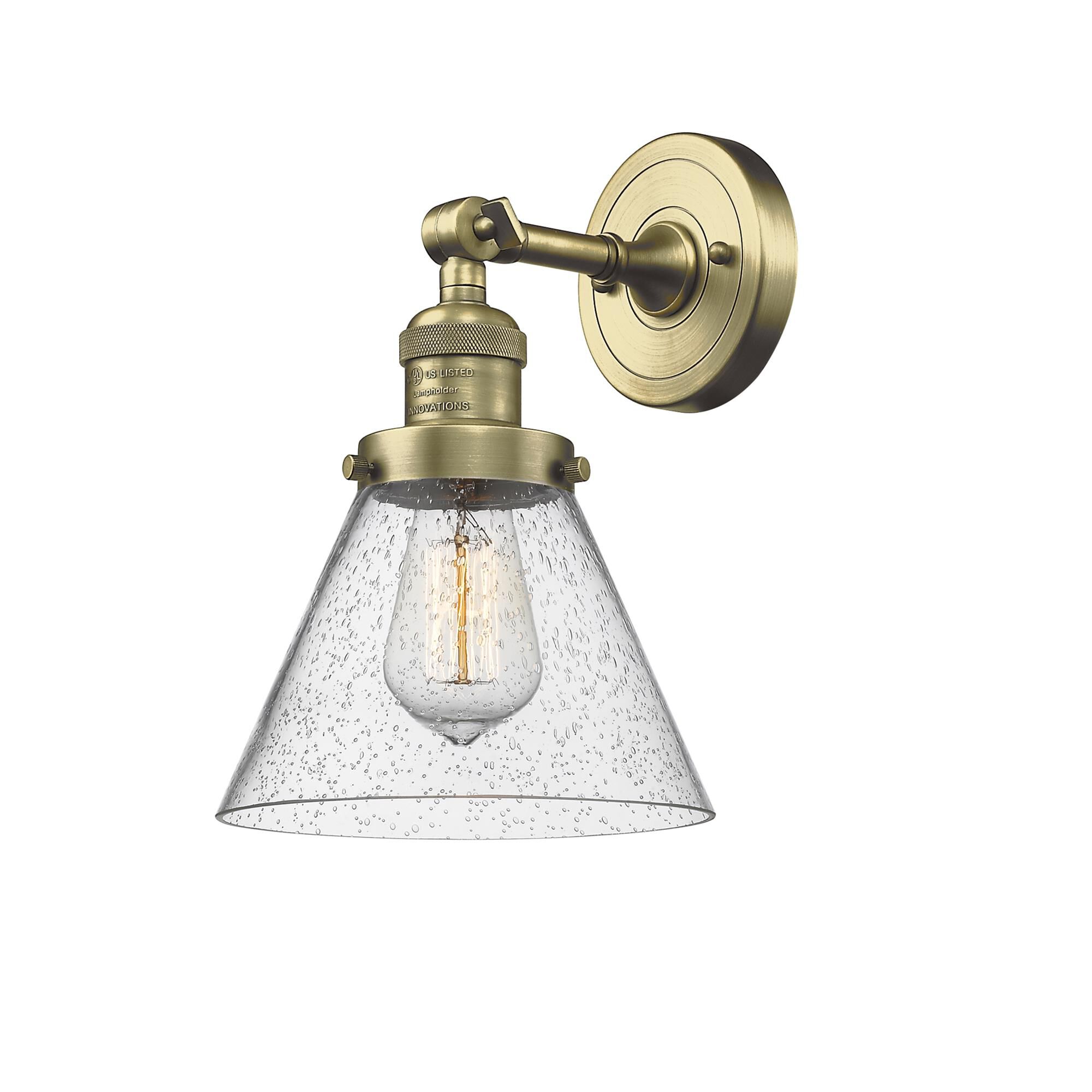 Shown in Antique Brass finish and Seedy glass