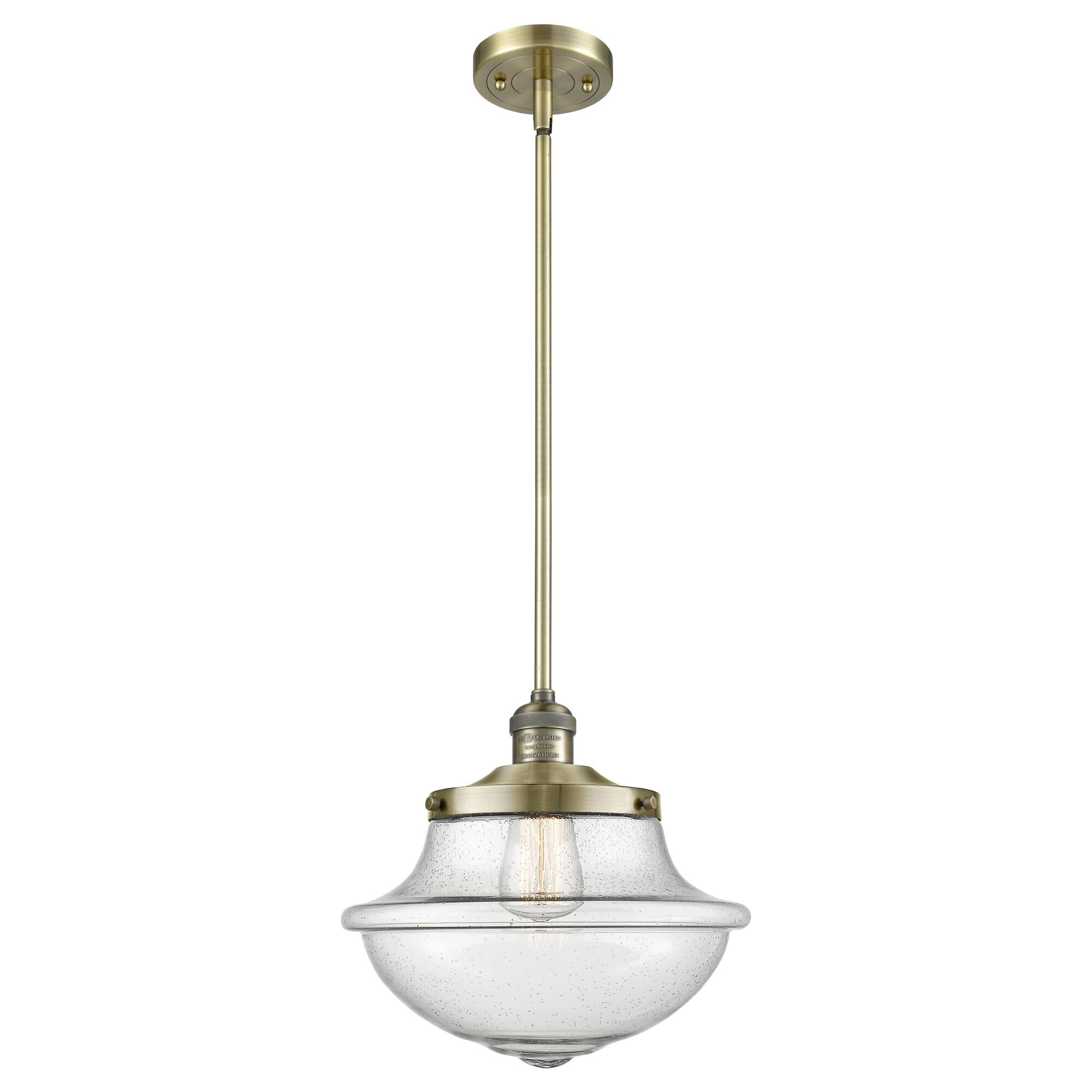 Shown in Antique Brass finish and Glass shade and Bulb Tint - Amber accent