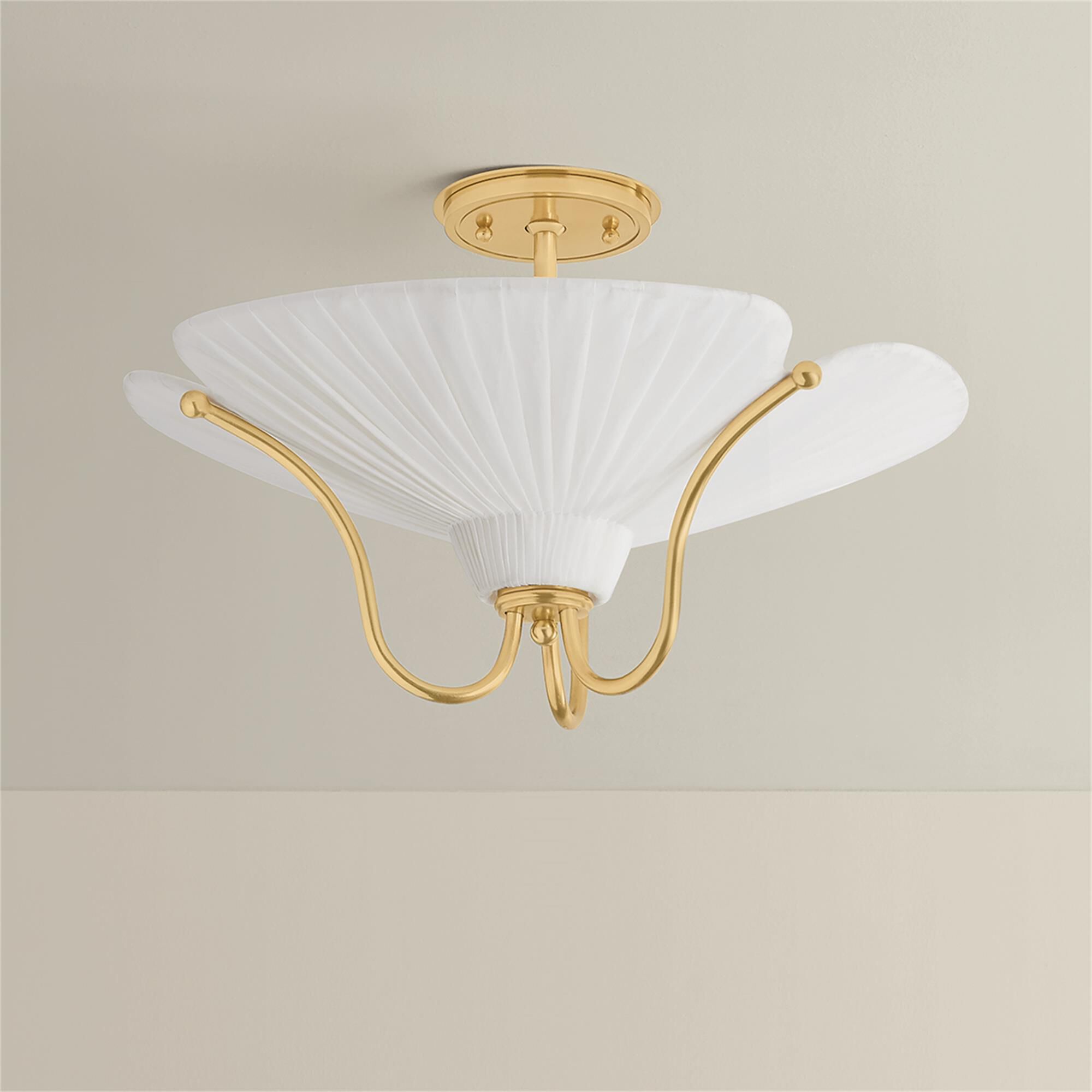 Shown in Aged Brass finish and Ivory Linen shade