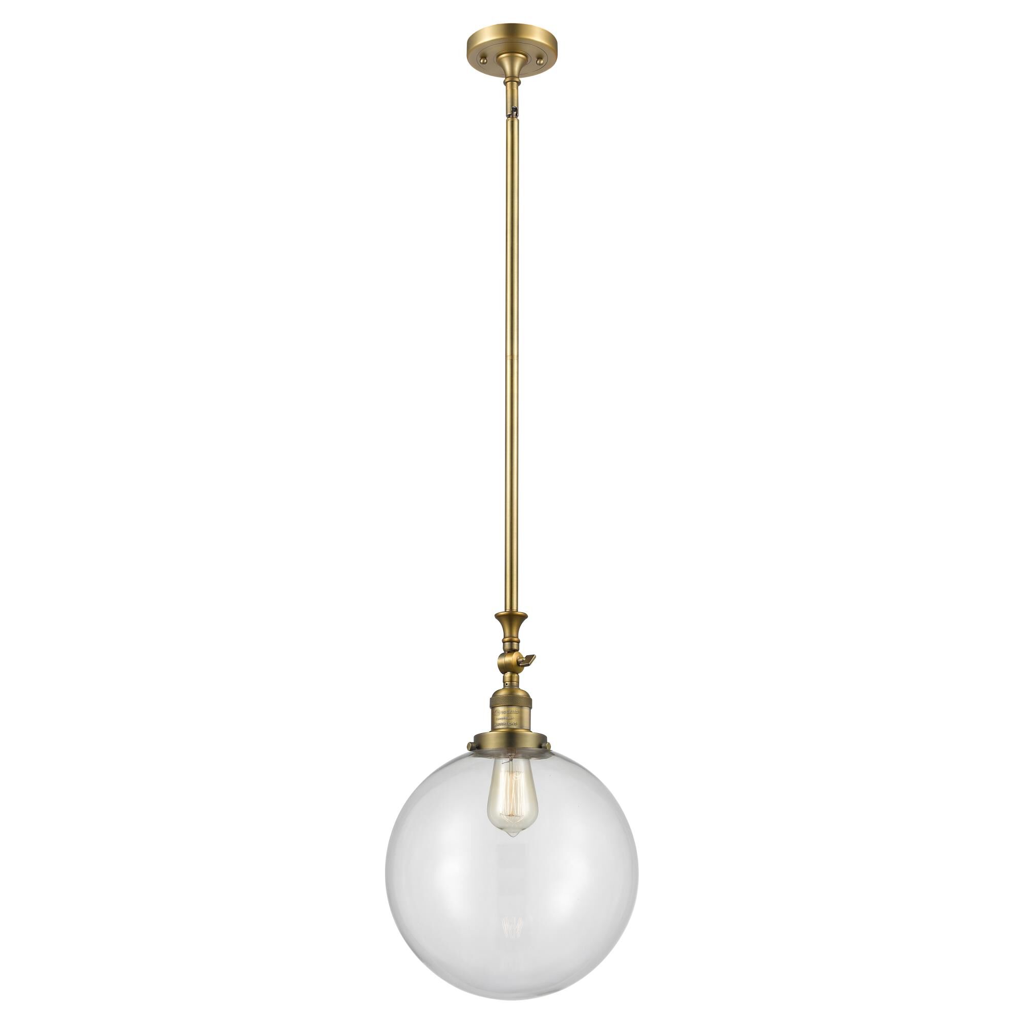 Shown in Brushed Brass finish and Clear Beacon glass