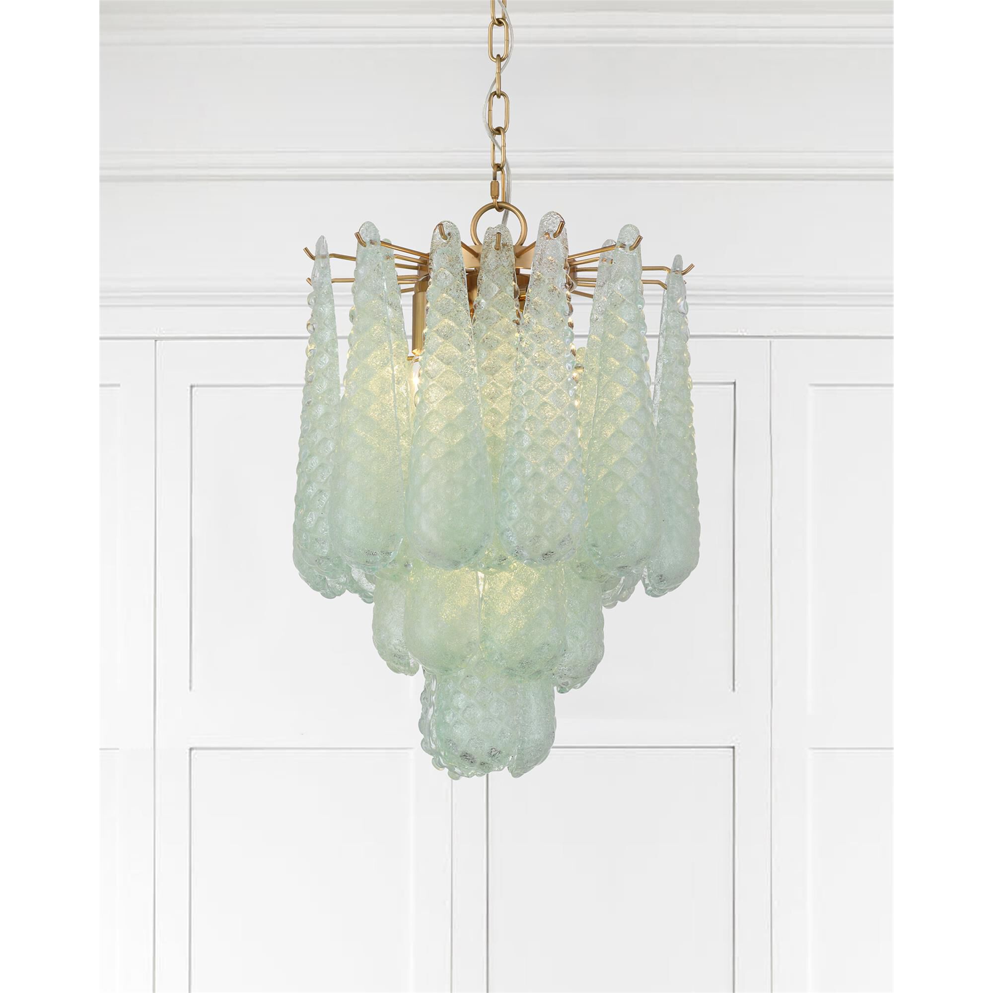 Shown in Aged Brass finish and Sand Green glass