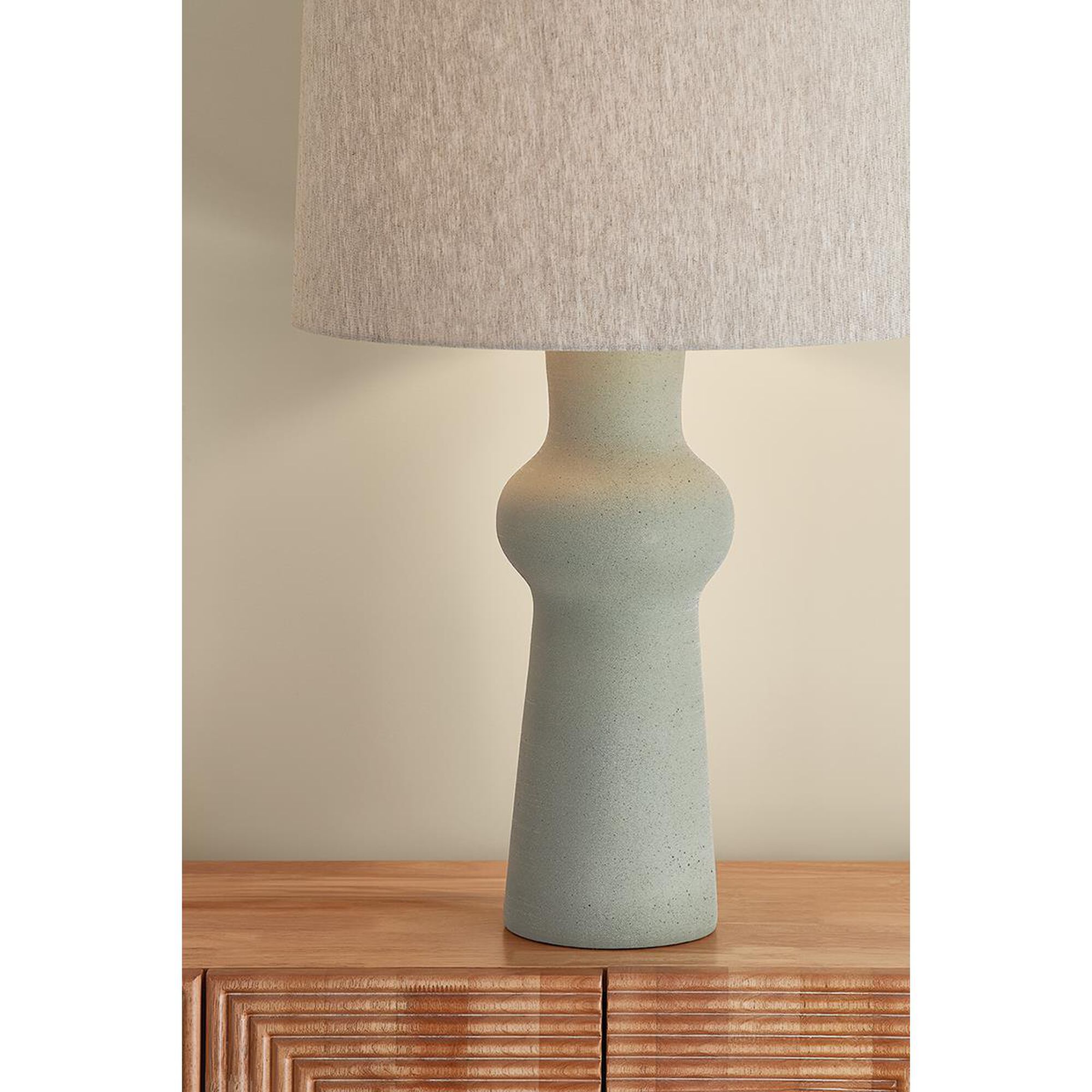 Shown in Aged Brass and Ceramic Hazy Jade finish and Natural Linen shade