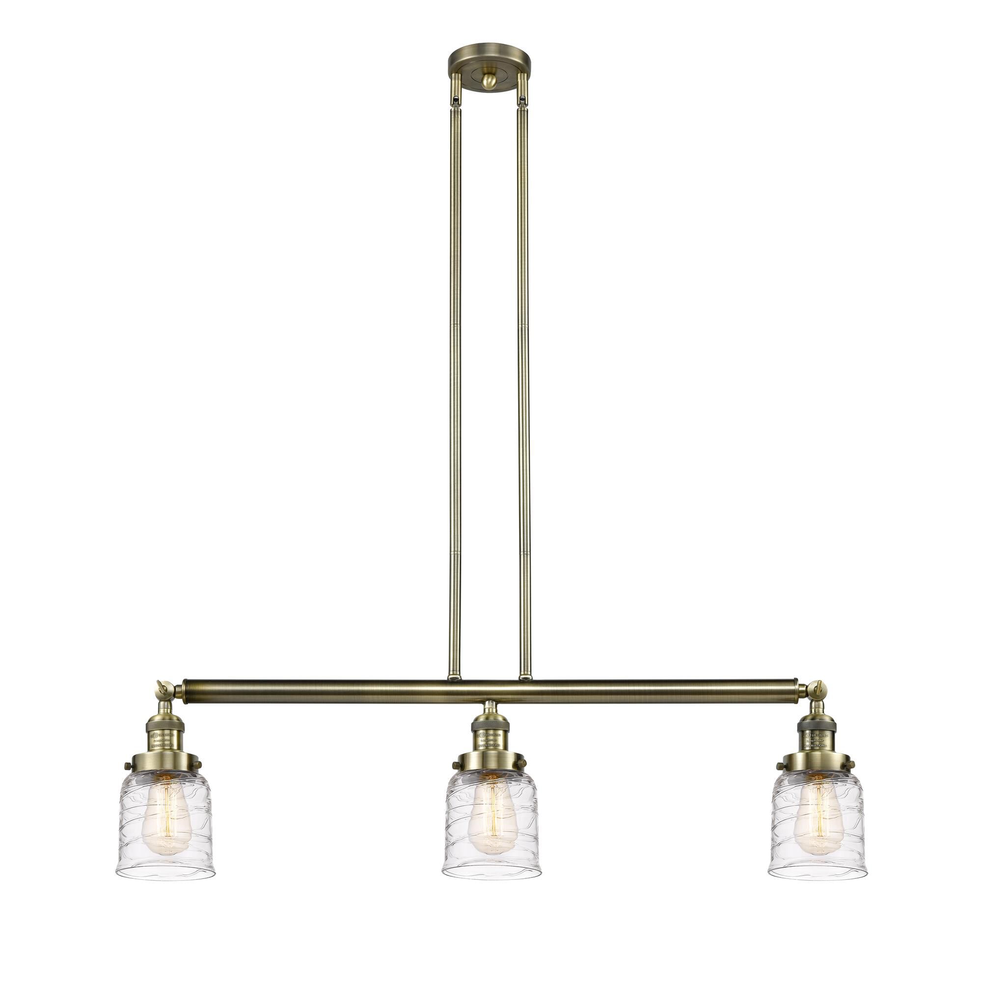 Shown in Antique Brass finish and Clear Deco Swirl Small Bell glass
