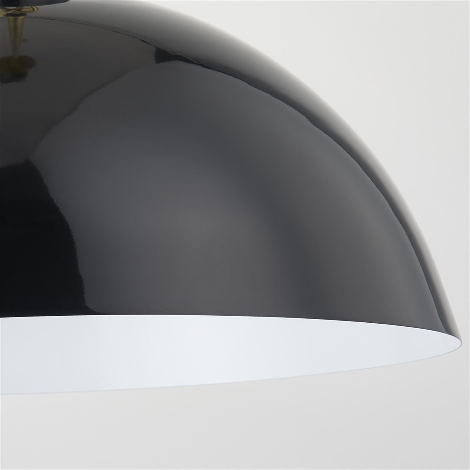 Shown in Aged Brass and Glossy Black finish and Metal shade