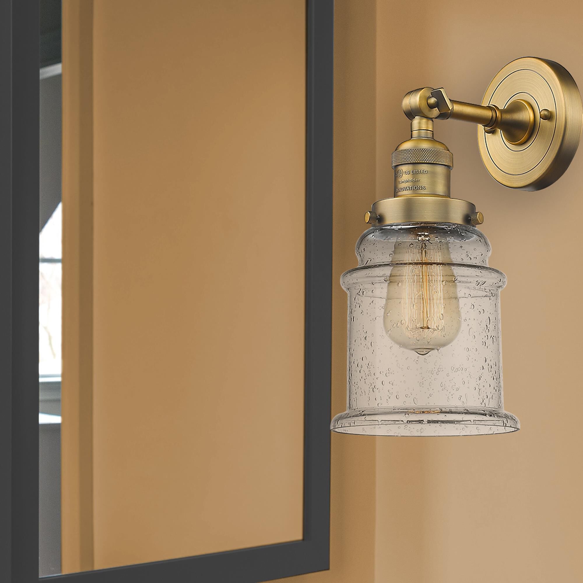 Shown in Brushed Brass finish and Seedy glass