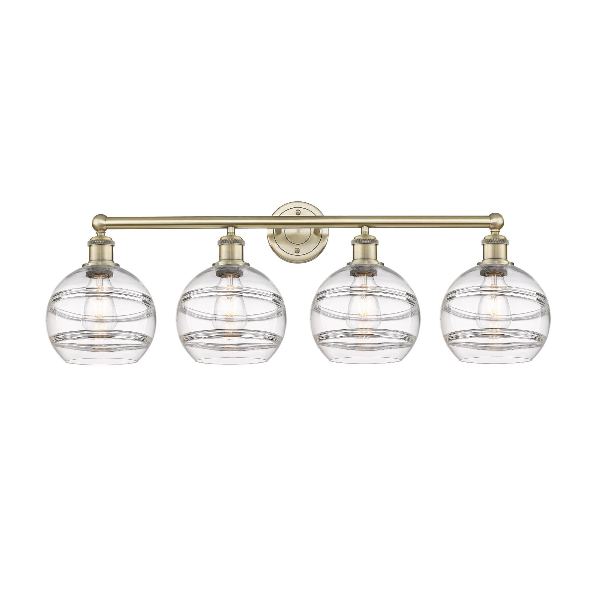 Shown in Antique Brass finish and Clear glass