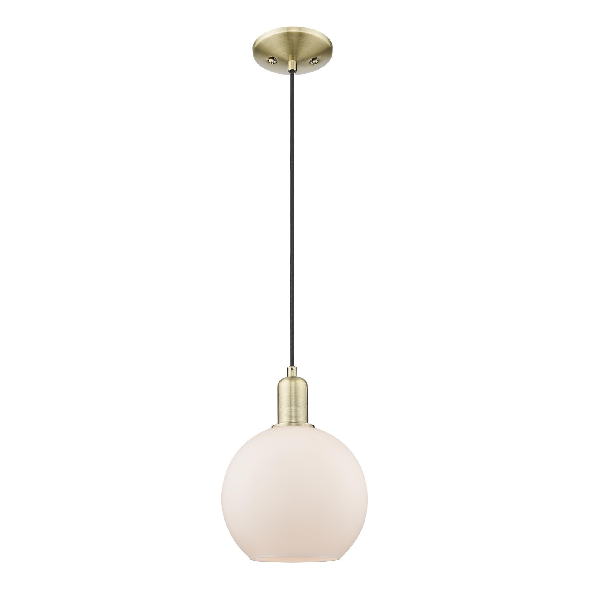 Shown in Antique Brass finish and Matte White glass