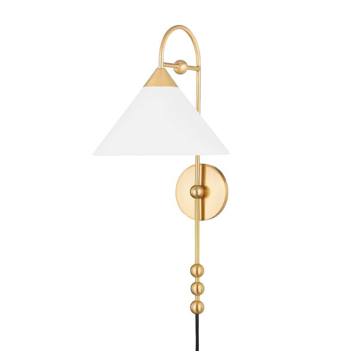 Shown in Aged Brass finish and White Linen shade