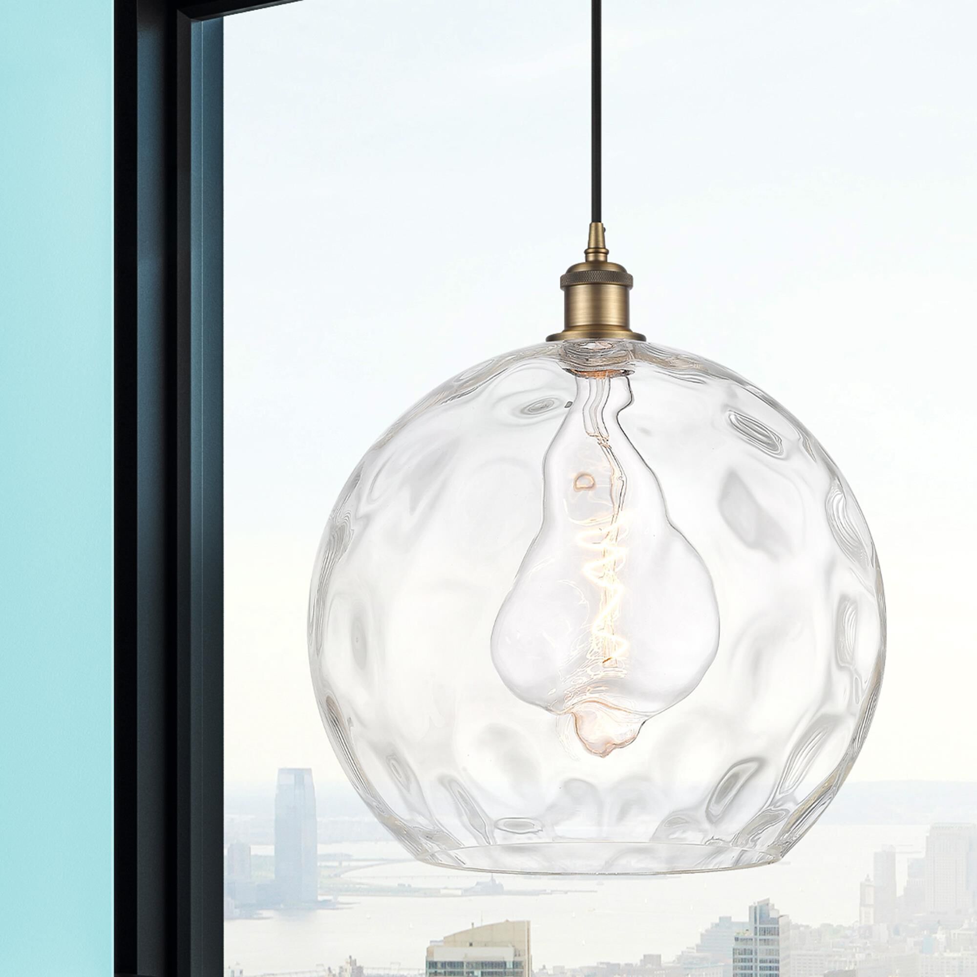 Shown in Brushed Brass finish and Clear glass