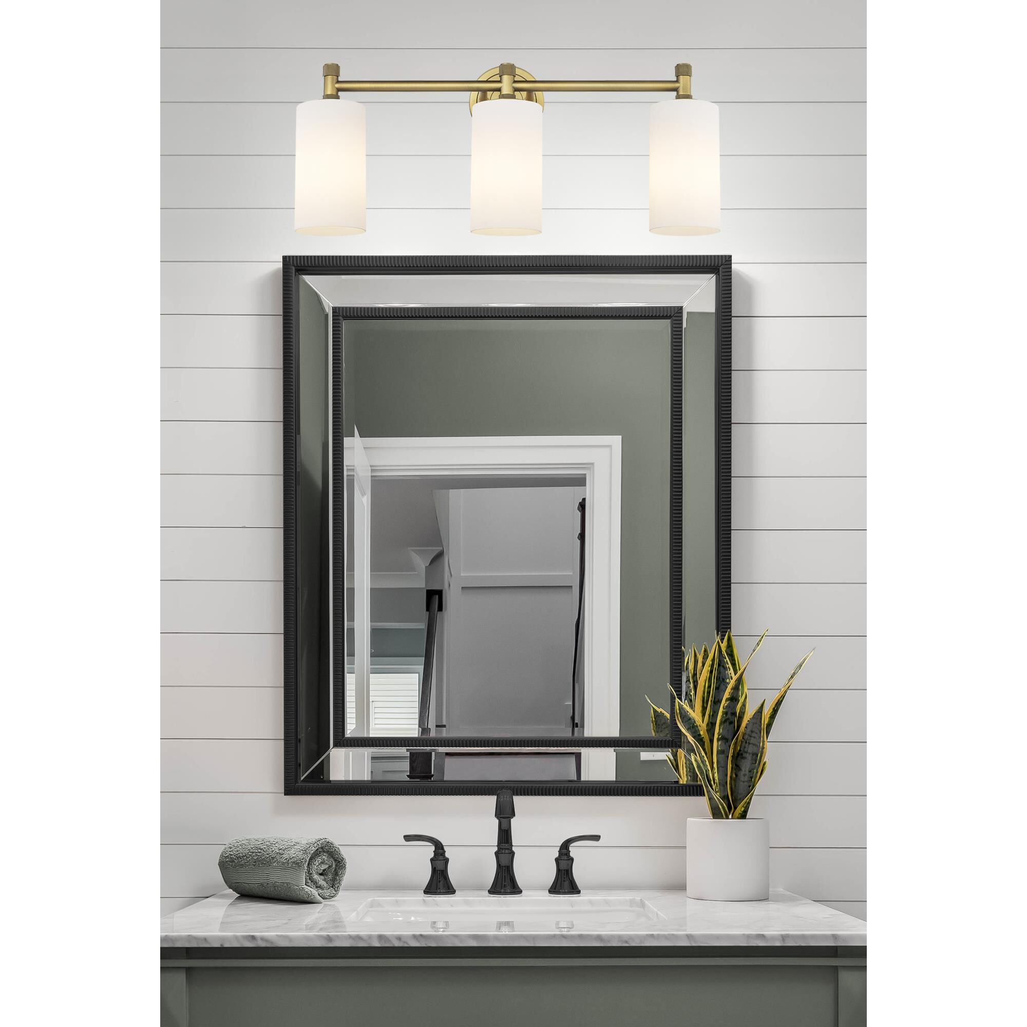 Shown in Brushed Brass finish and Matte White glass