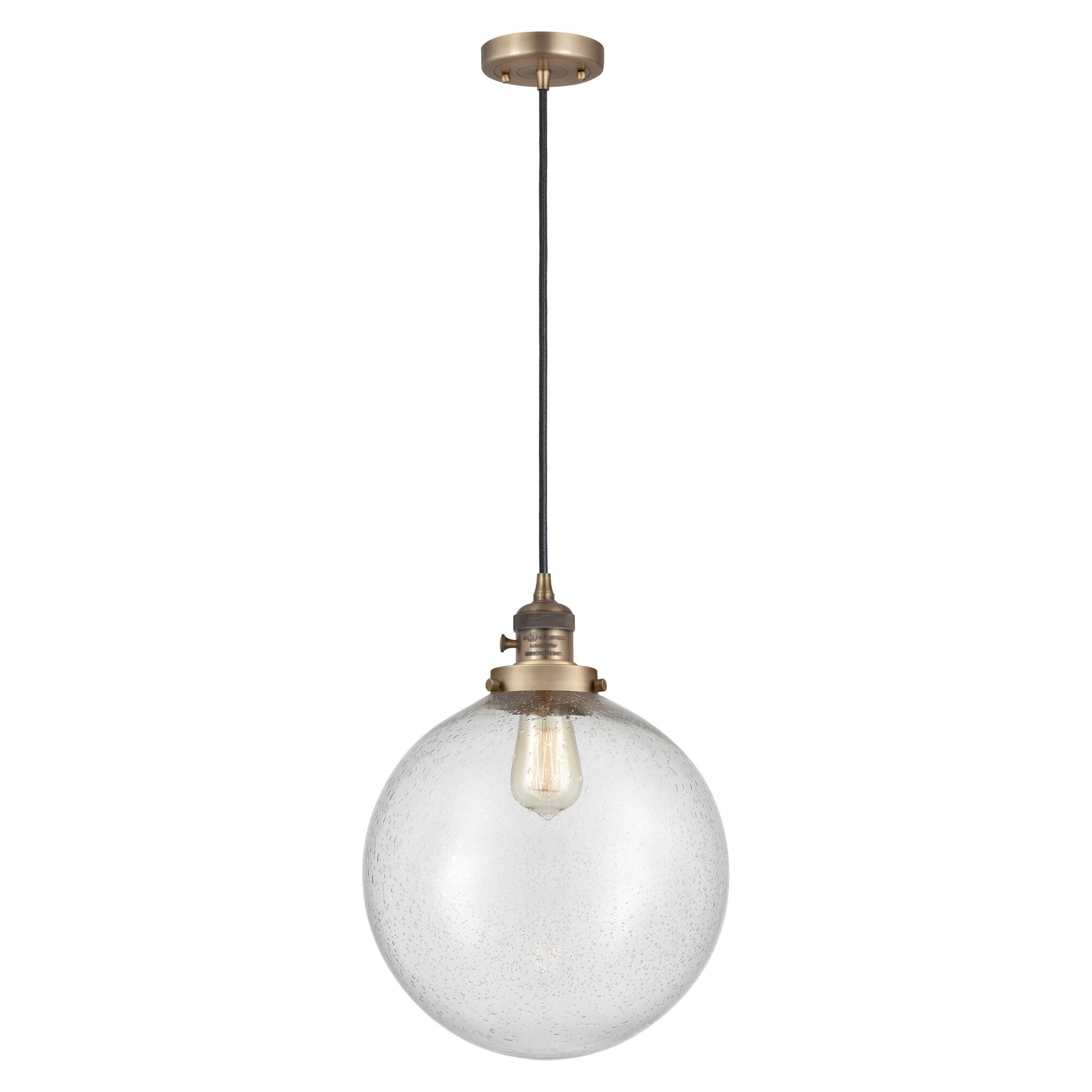 Shown in Brushed Brass finish and Seedy glass