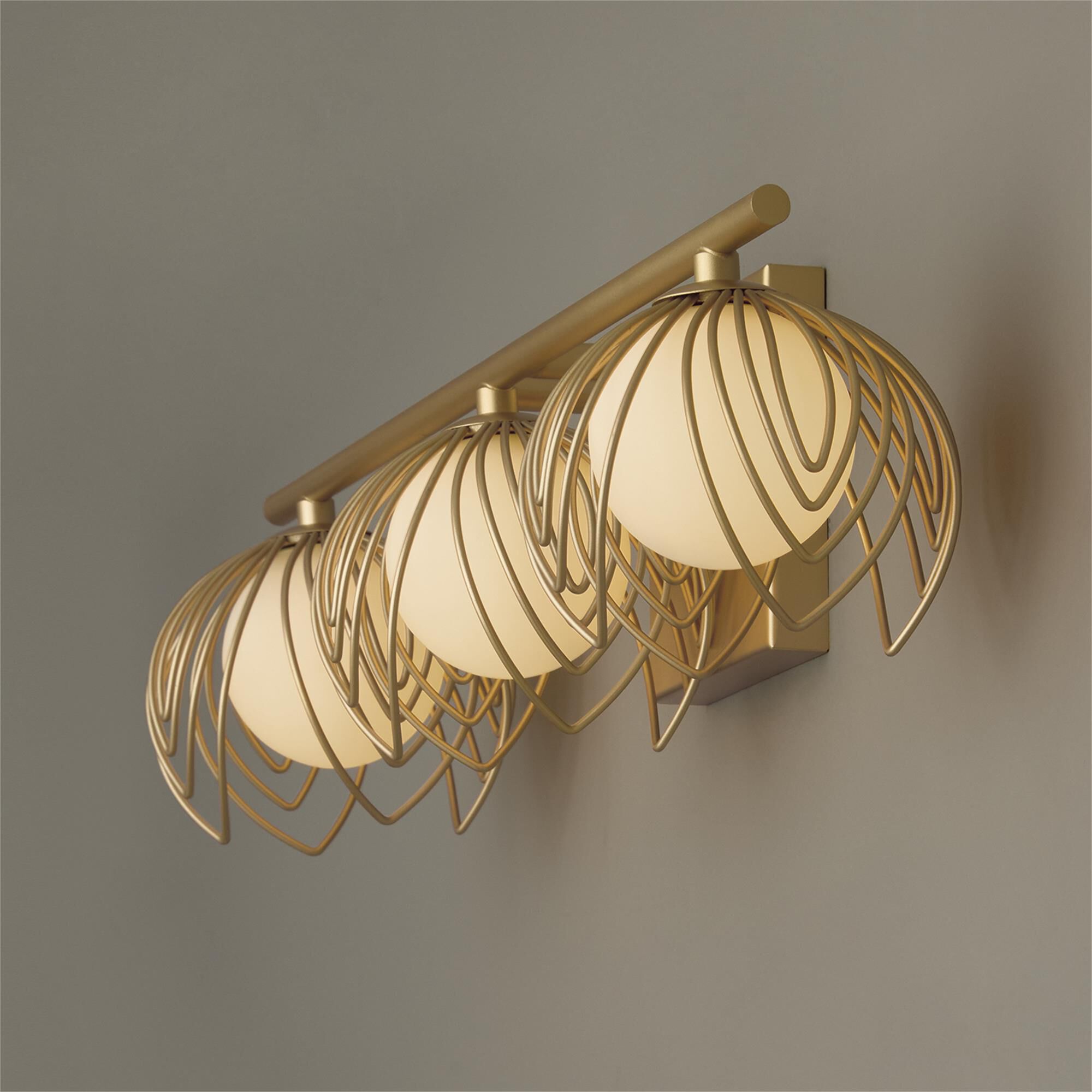 Shown in Buffed Gold finish and Soft White  Globes glass