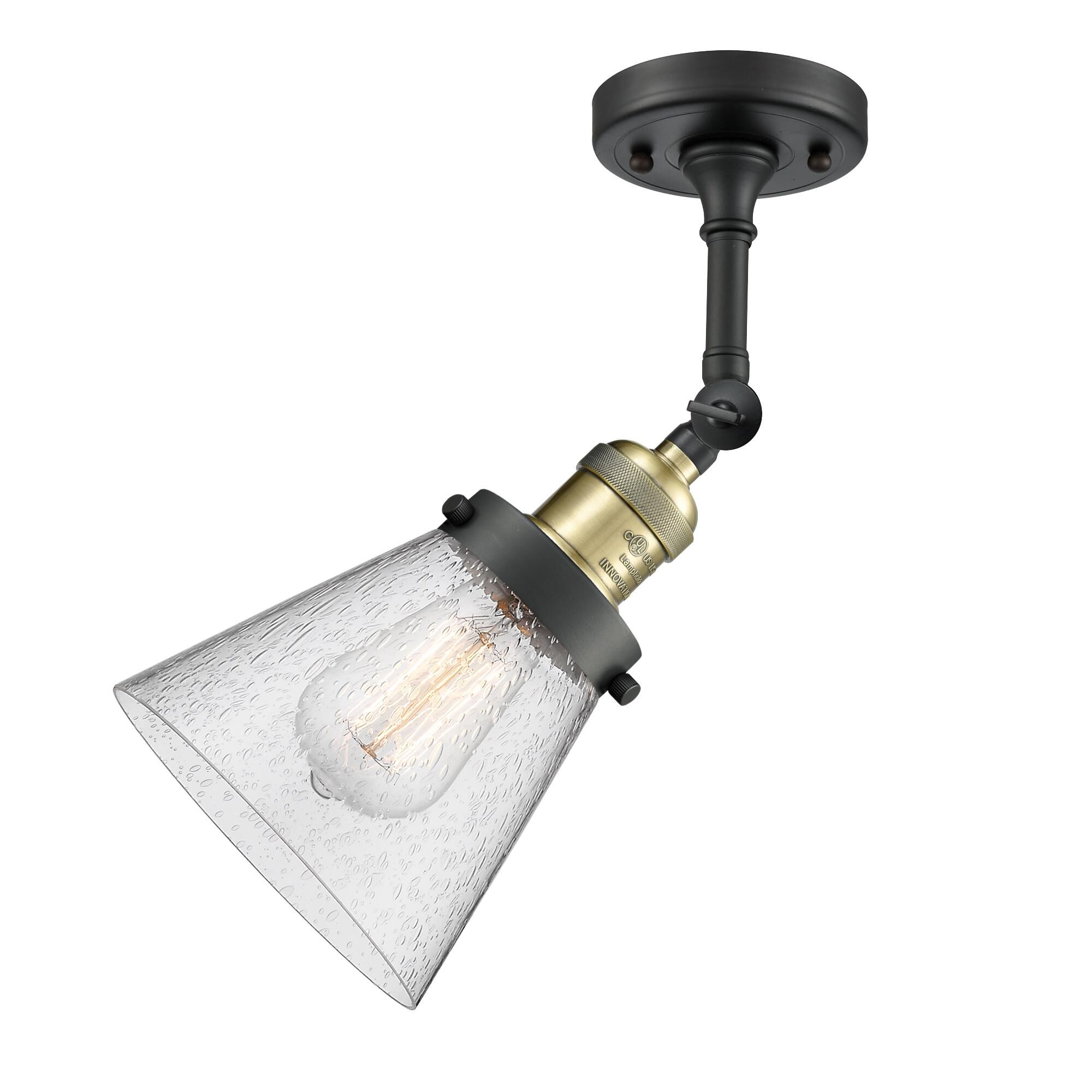 Shown in Black Antique Brass finish and Seedy glass and None accent