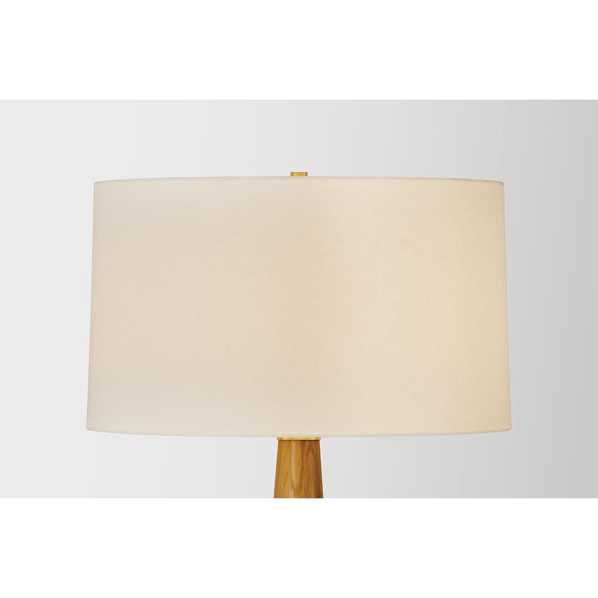 Shown in Aged Brass finish and White Linen shade