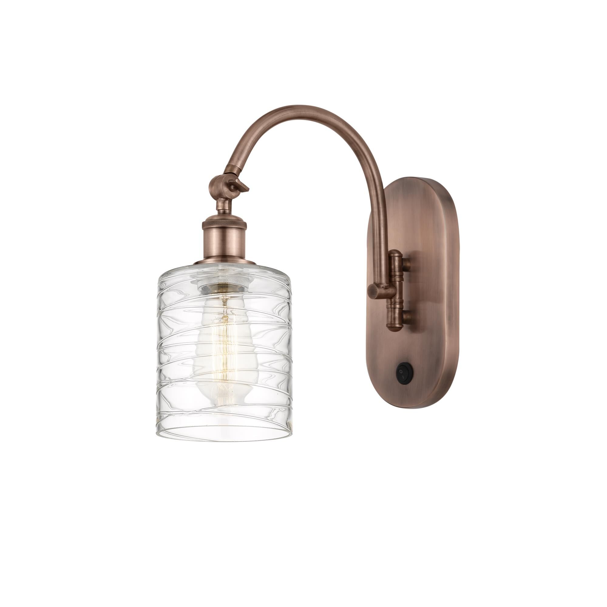 Shown in Antique Copper finish and Deco Swirl glass