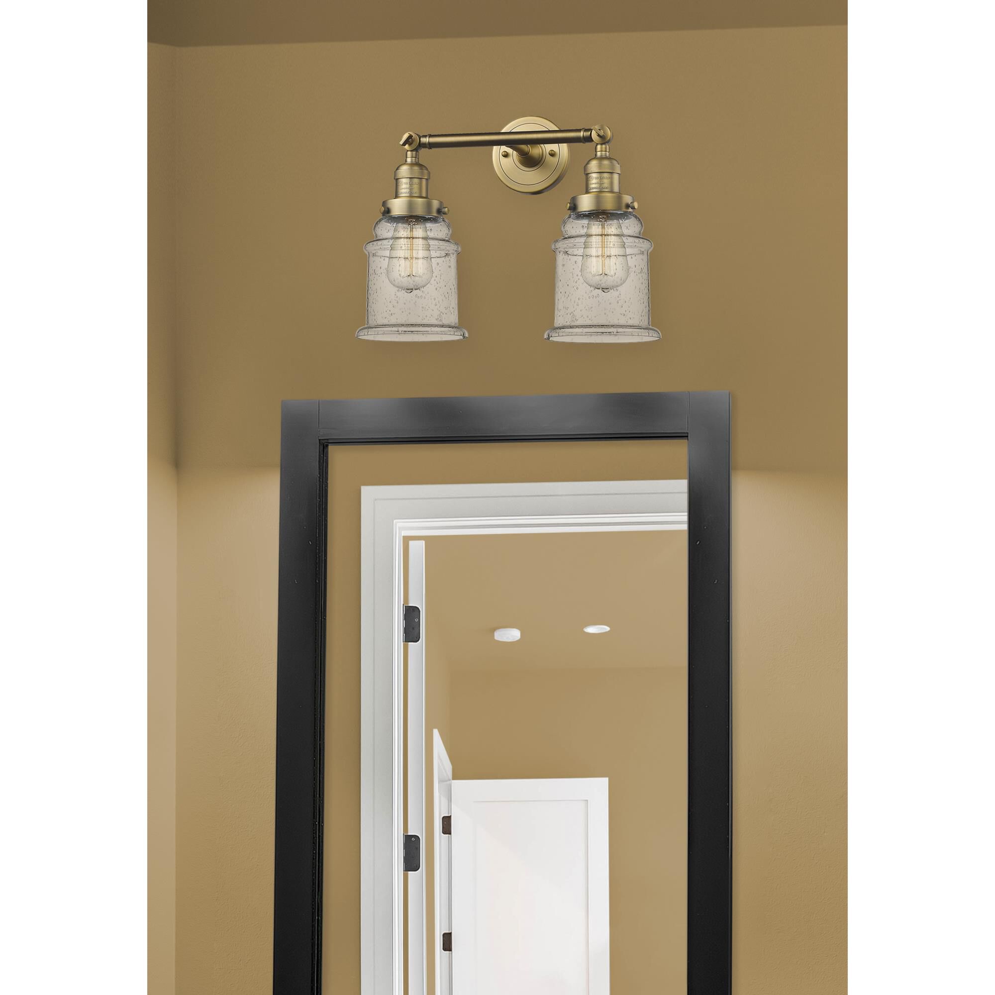 Shown in Brushed Brass finish and Seedy glass