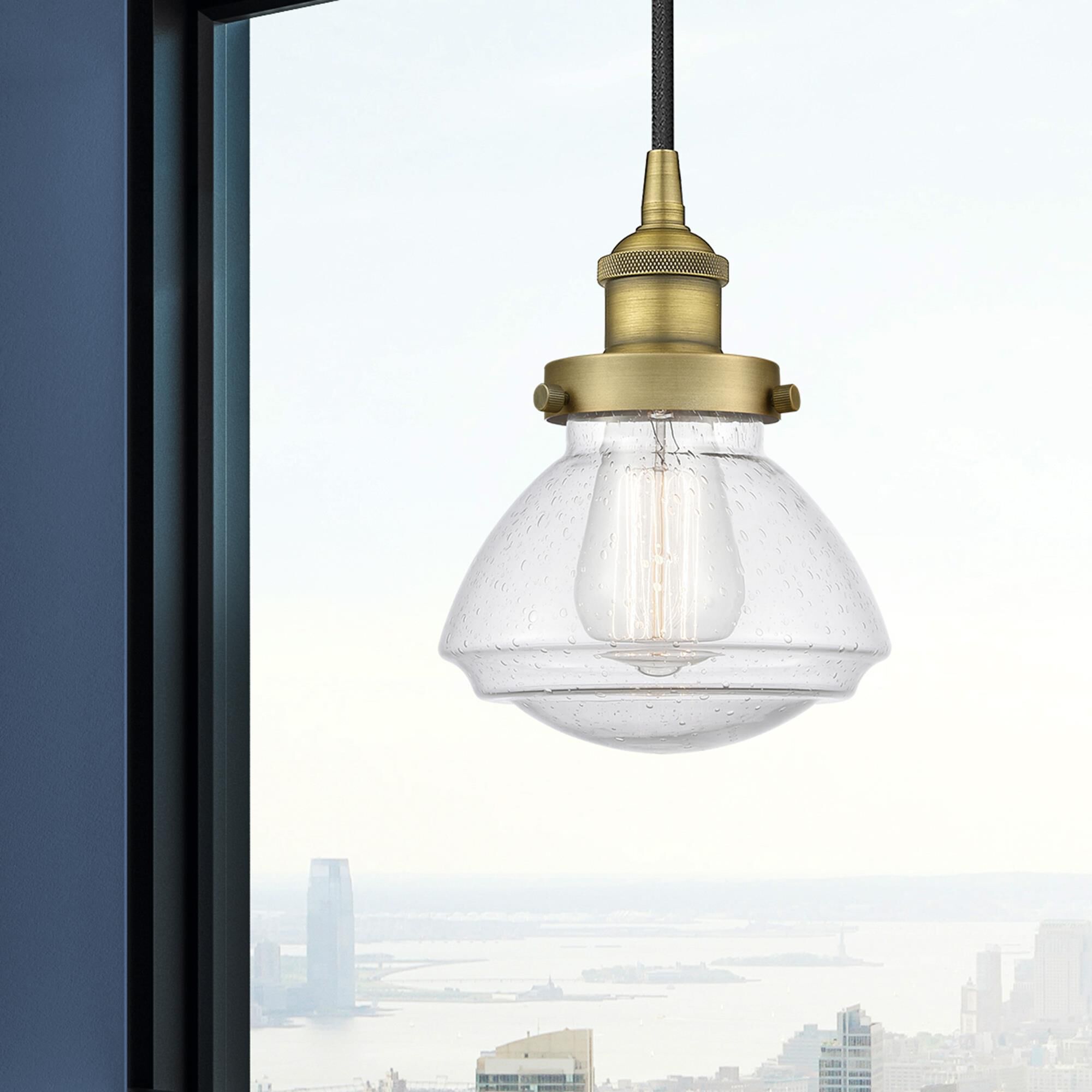 Shown in Brushed Brass finish and Seedy glass