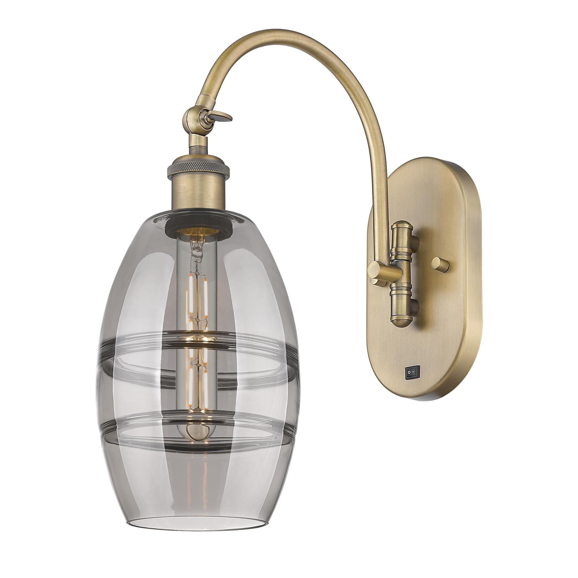 Shown in Brushed Brass finish and Light Smoke glass
