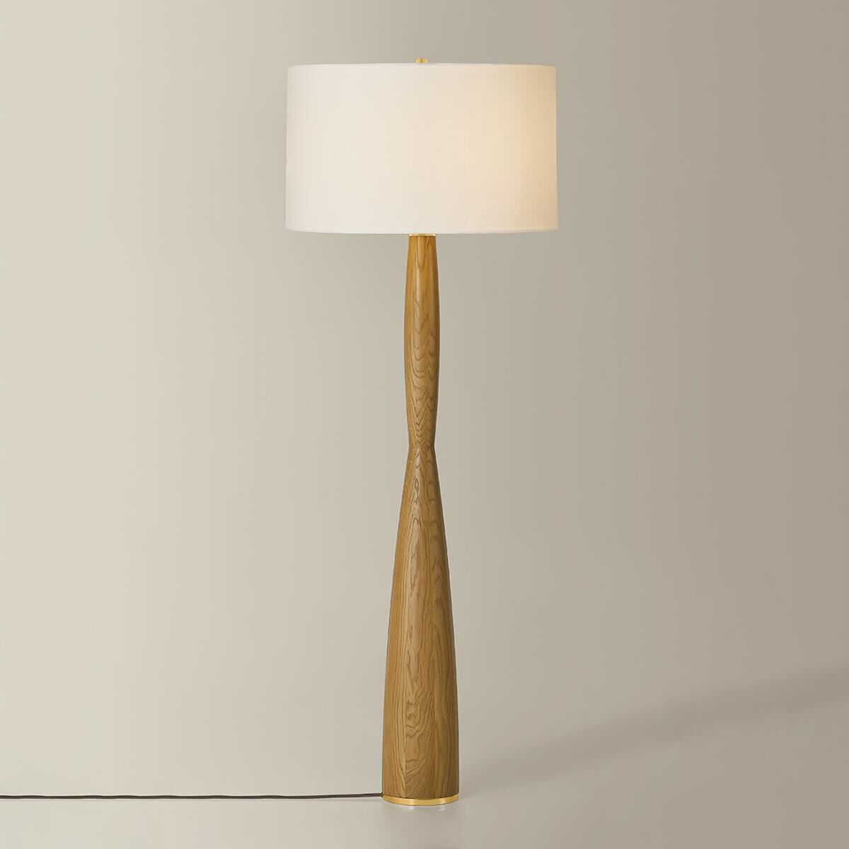 Shown in Aged Brass finish and White Linen shade
